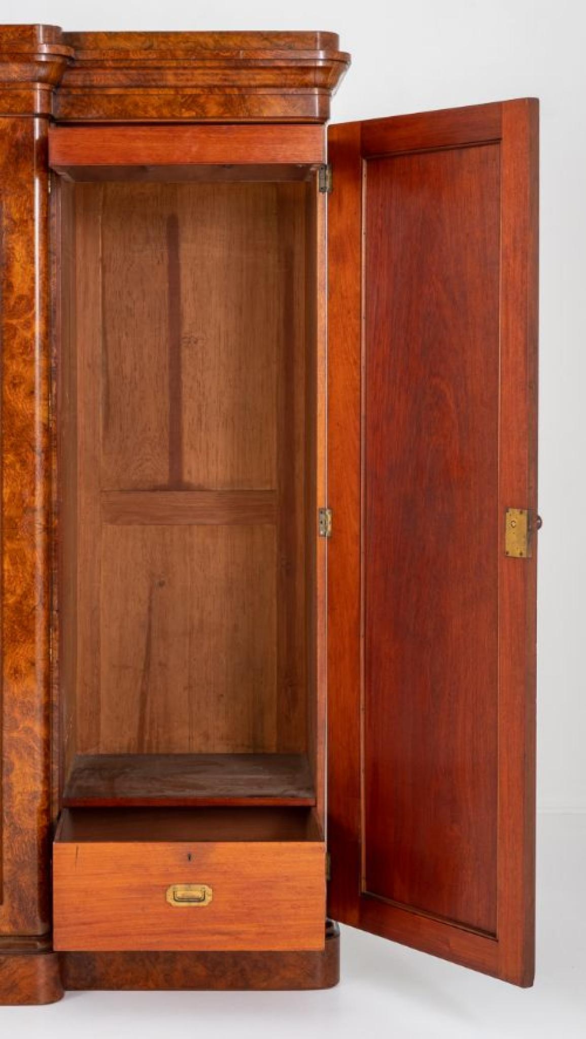 Superb quality Victorian burr walnut gentleman's wardrobe
Circa 1860
This wardrobe has the highest burr walnut timbers
The wardrobe is of breakfront form, the central door featuring a full length mirror
The left hand door and central door opening to