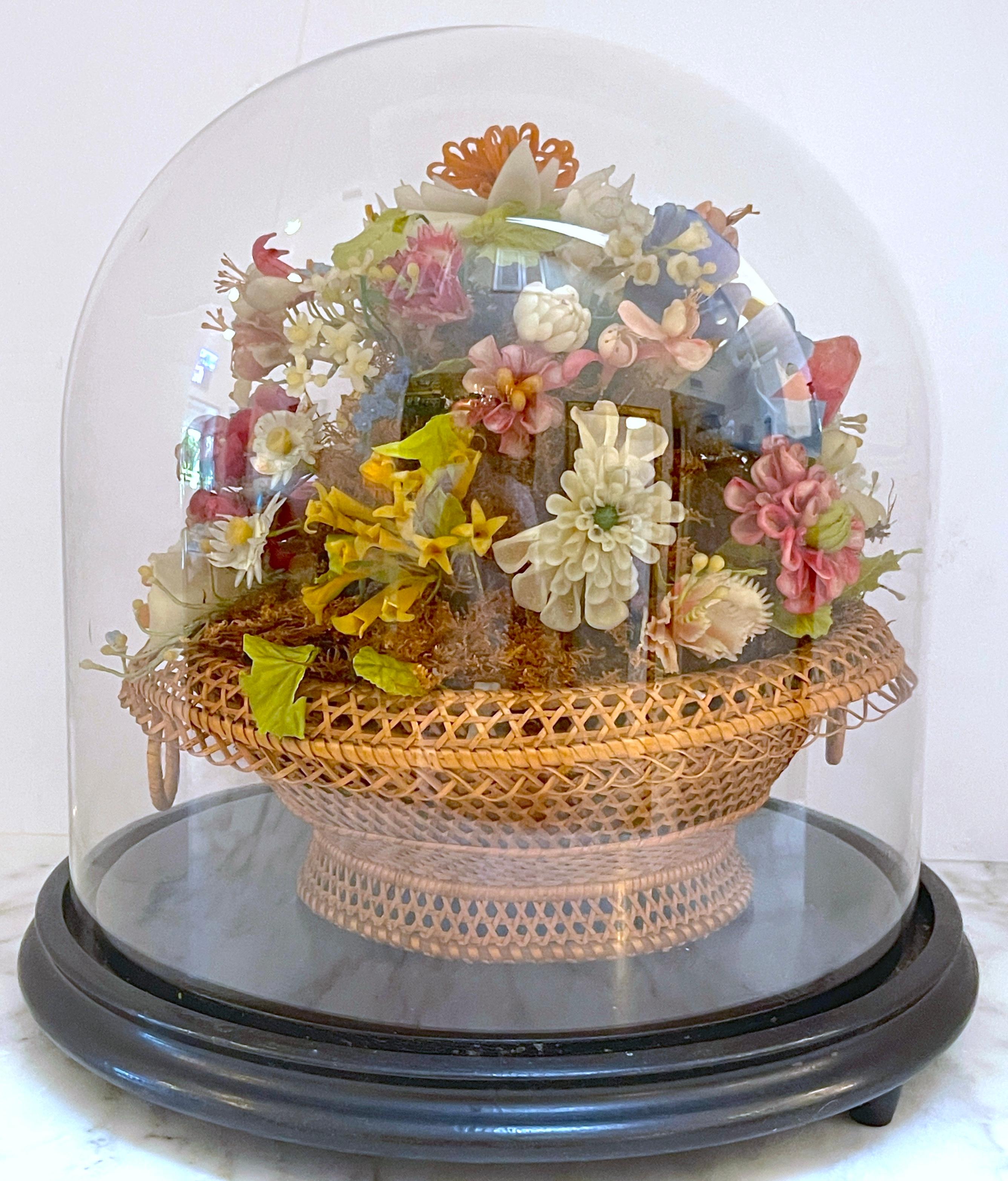 Victorian Wax Flower Still Life Basket Under Round Glass Dome
USA, Circa 1880 

A glimpse of  the opulent world of the 19th century with this captivating Victorian wax flower still life basket, a testament to unparalleled artistry from the USA circa