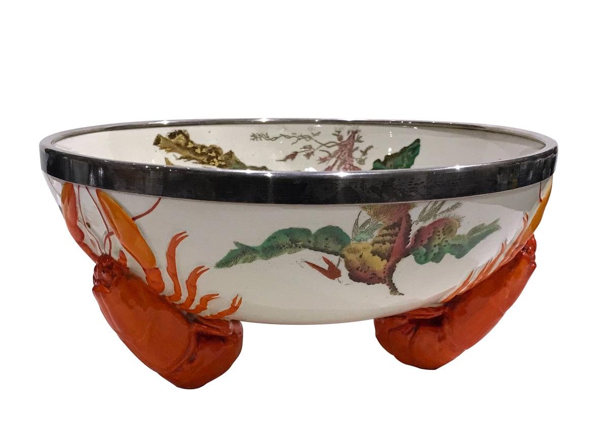 Original Victorian Wedgwood Lobster Salad Bowl. Cream background earthenware the bowl is decorated all around with printed and hand-painted seaweeds inside and outside the bowl. The base is composed of three lobsters as feet. The rim is finished