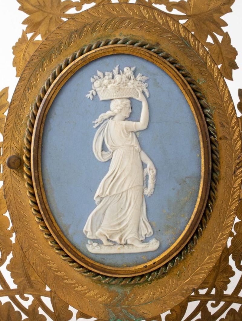 Victorian Wedgwood Mounted Gilt Metal Triple Frame, Howell, James & Co. of Regent Street, London, mounted with an old Wedgwood blue jasperware plaque after designs by John Flaxman (English, 1755-1826), marked 