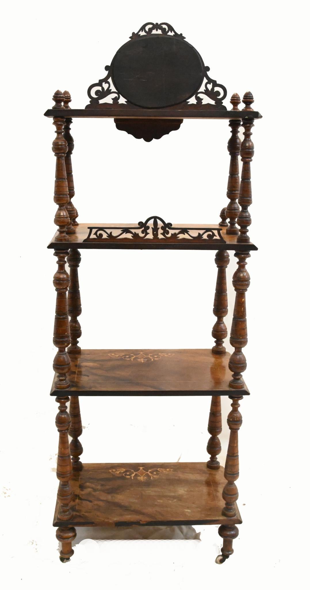You are viewing a refined Victorian whatnot or bookshelf
Circa 1860
Lavish patina to the mahogany
A Victorian whatnot is an elegant, multi-tiered shelving unit, often made of dark wood with intricate carvings and spindle supports, designed to