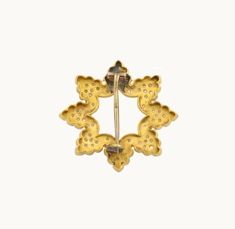 Victorian antique snowflake brooch in 18 karat yellow gold from circa 1900.  This beautiful brooch features white enamel with 56 rose cut diamonds.  Looks fantastic on both men and women!

This brooch measures approximately 1.23 inches in height,