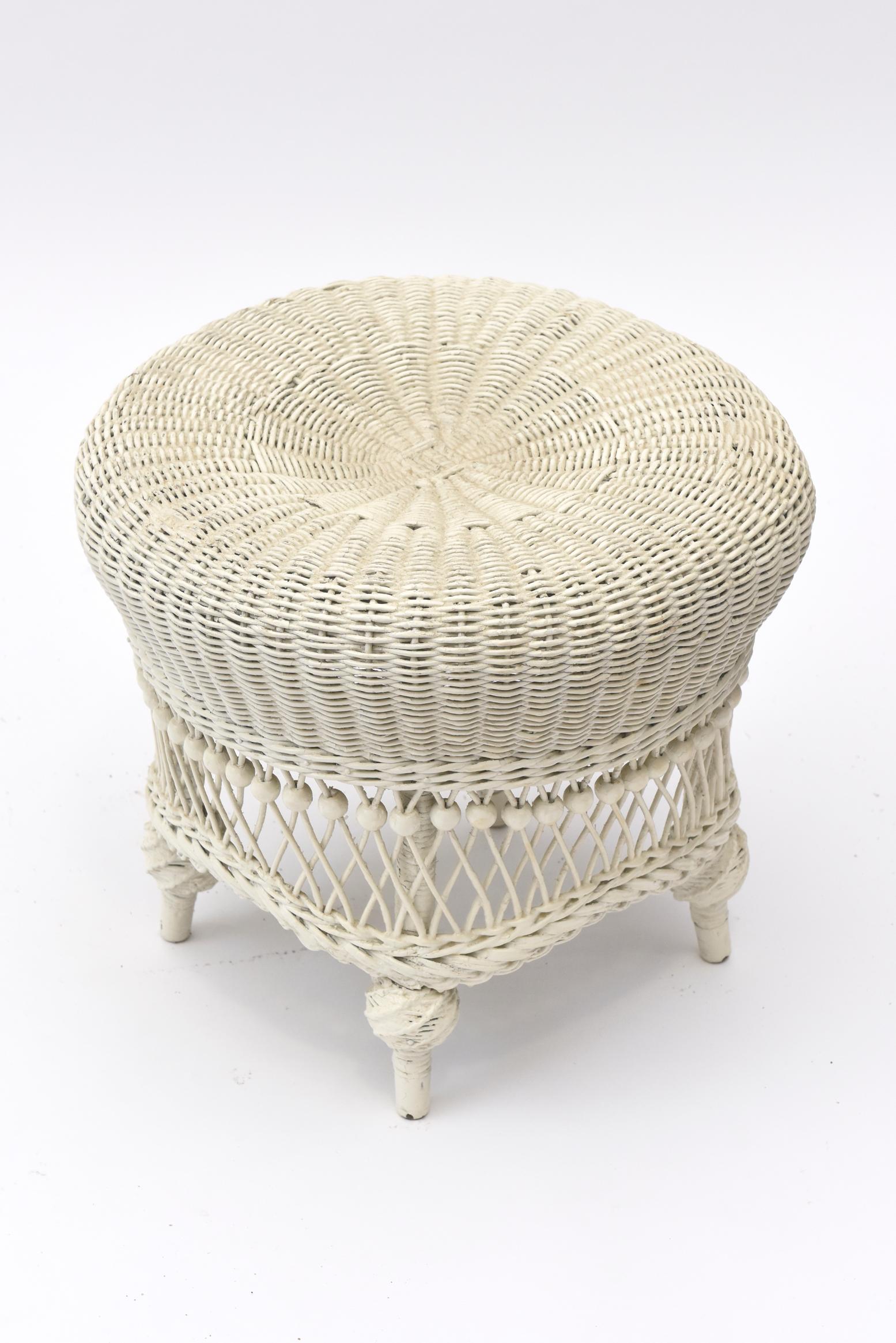 Part of a large collection of ornate Victorian wicker that was collected over the years by a Senator's wife. A magnificent example of a Mid Victorian beaded foot stool, it has a tightly woven indented rolled top. Beneath the top is a row of beads to