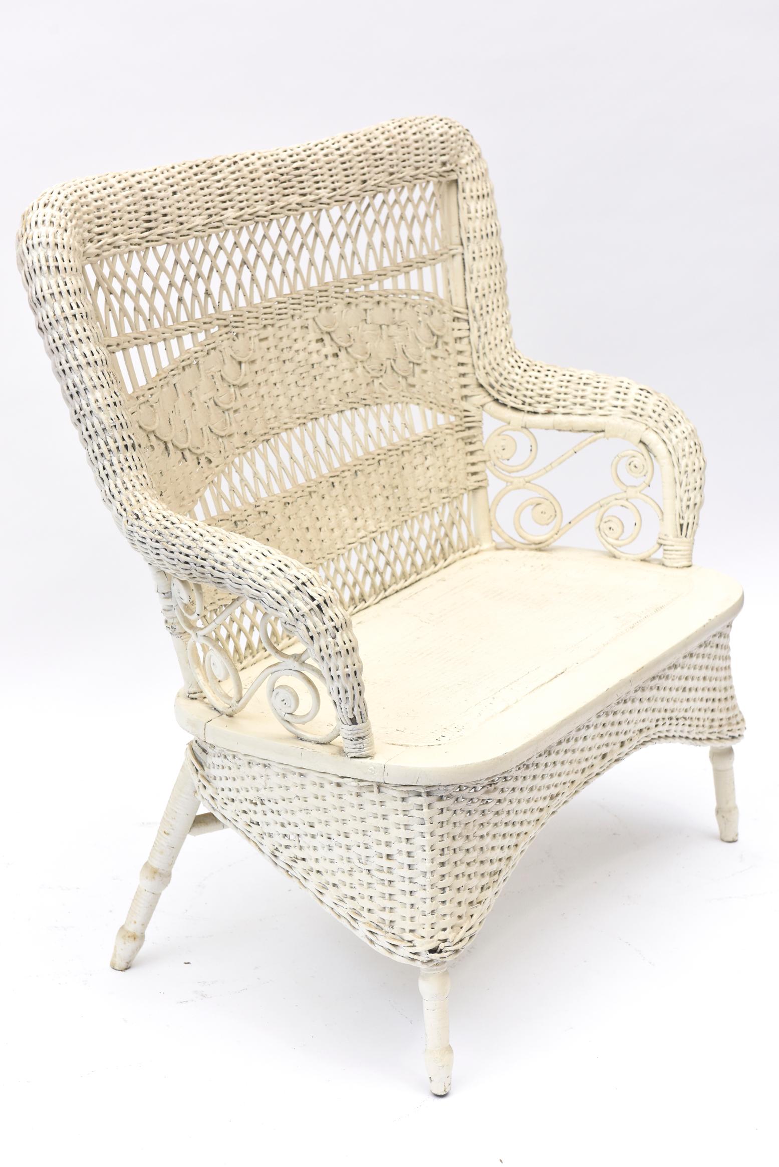 white wicker love seat