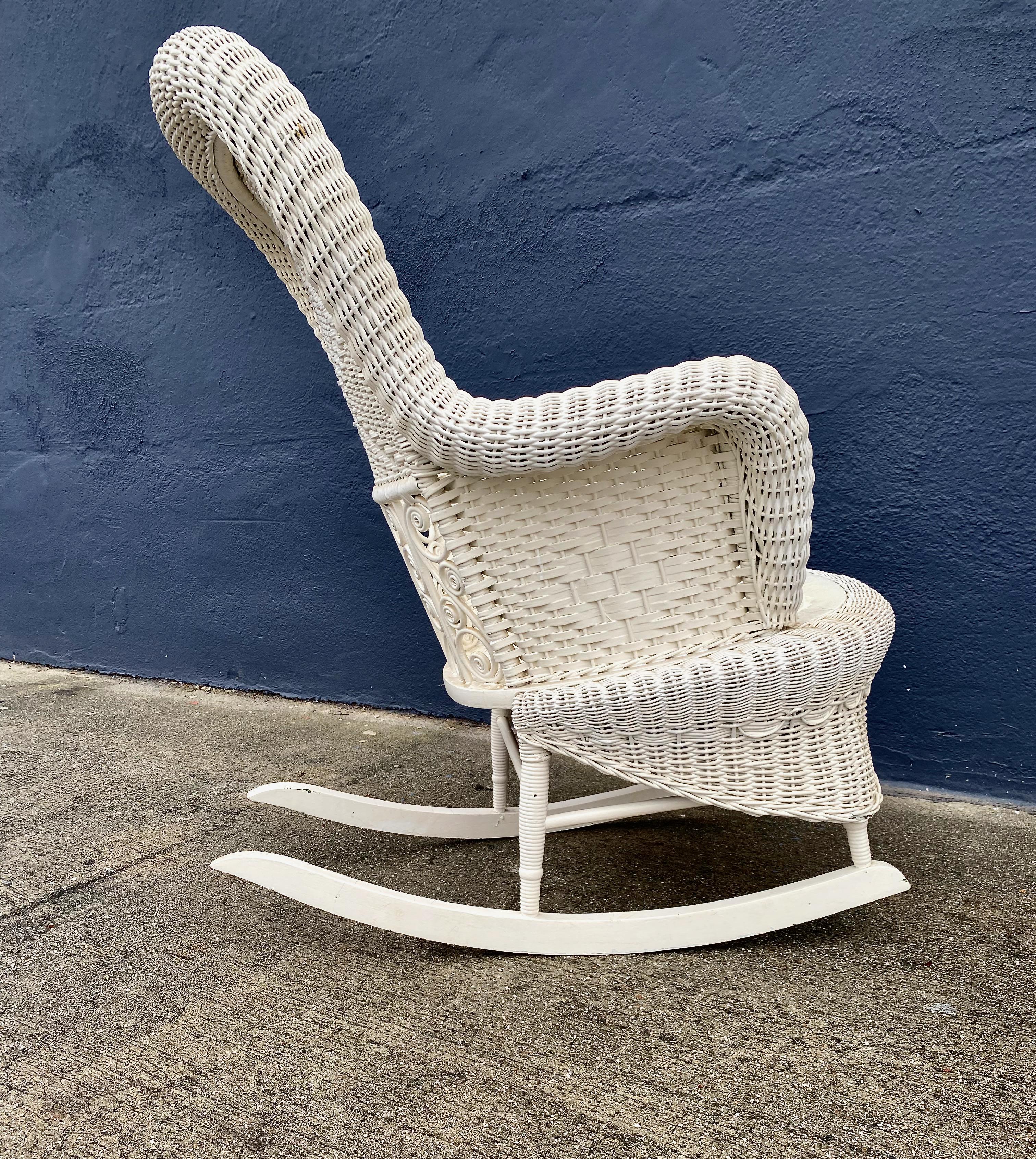 white wicker rocking chair