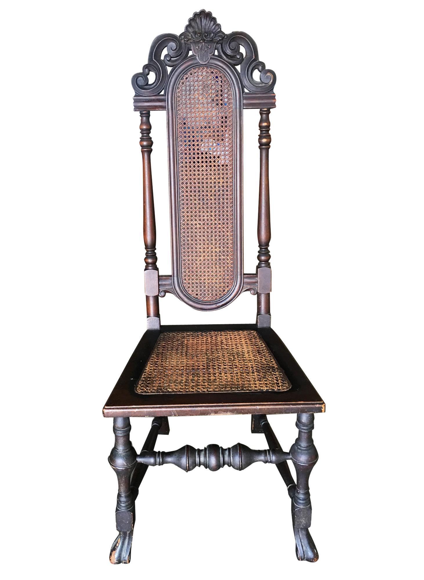 Victorian hand carved oak Gothic Revival side throne chair with woven cane wicker back and seat,
circa 1860.
