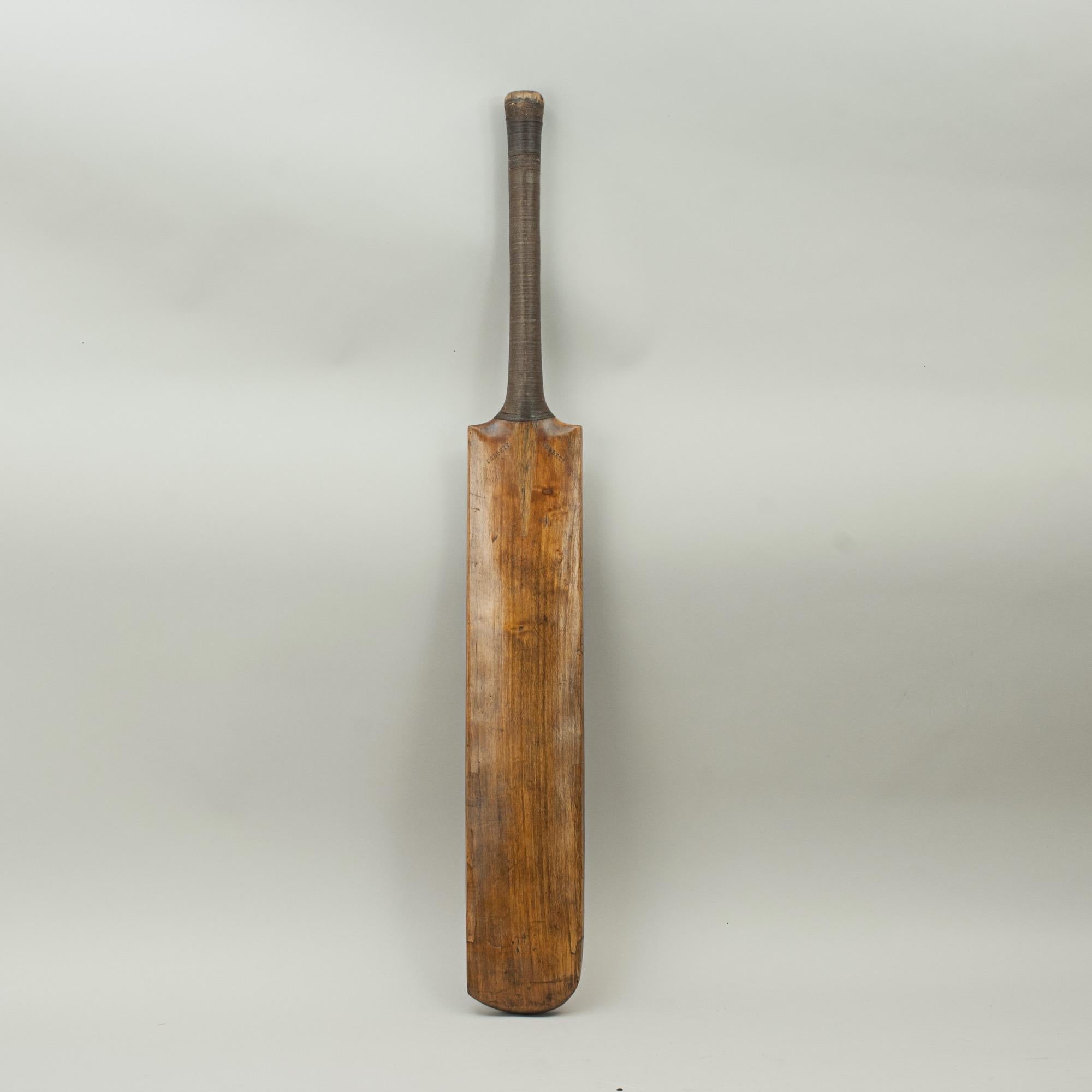 Antique Cobbett cricket bat.
A good Victorian cricket bat by Cobbett, in nice condition with good colouring and patina. The bat is with rounded shoulders and flat rounded back and with corded grip. The blade is stamped 'COBBETT' on both shoulders