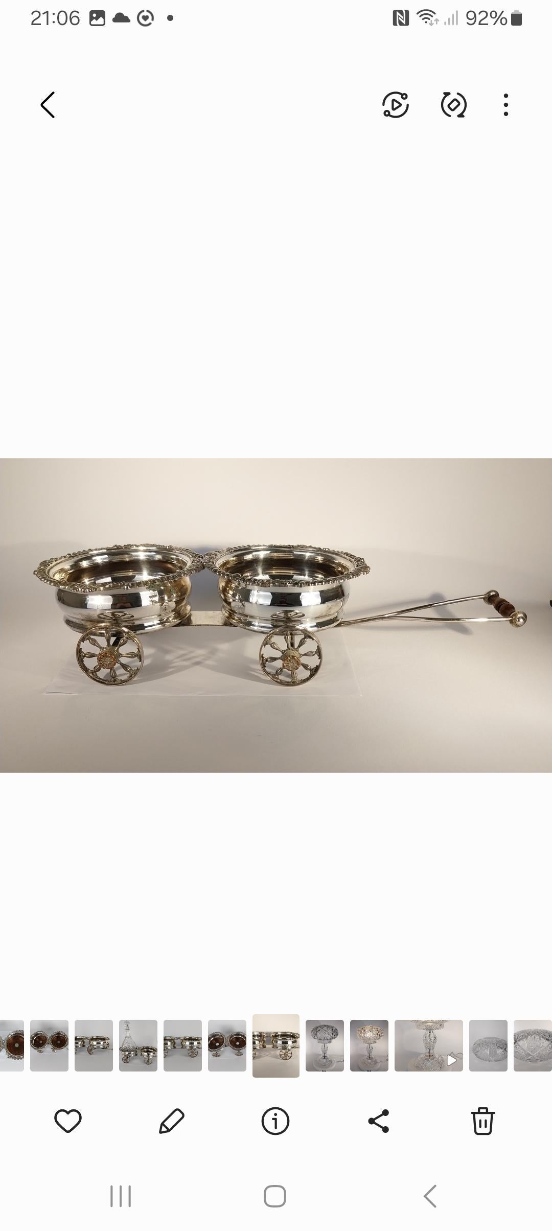 A rare and lovely example of a Victorian novelty item and splendour to be used to travel around the dining table to offer wine o ones guests.
A lovely quality Silver Plate Wine Carriage with twin bottle holders sitting in individual gadrooned and