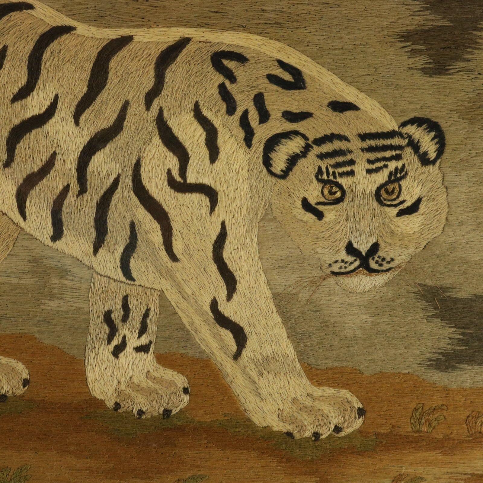 Victorian Woolwork Embroidered Picture of a Tiger. The embroidery is worked in wool on canvas ground, in a variety of stitches. Pictorial scene of a Tiger in a tropical landscape. This embroidery is inspired by a famous print entitled Tyger, by