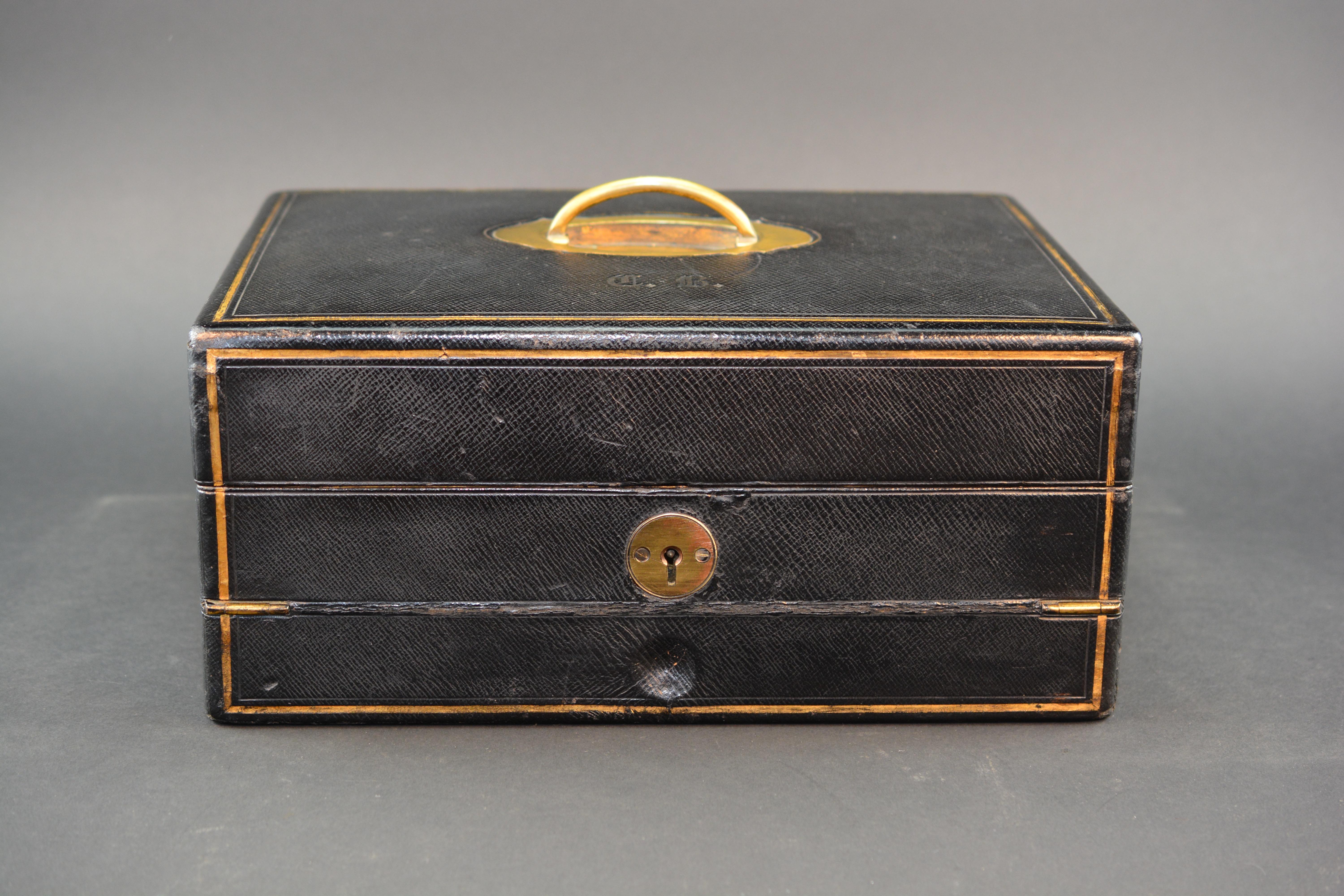A super quality Victorian writing box by P&F Shafer of 27 Piccadilly London. Hand made from embossed leather with gilt tooling and gilded brass fittings. The box opens to reveal original inkwells, various compartments and sprung correspondence