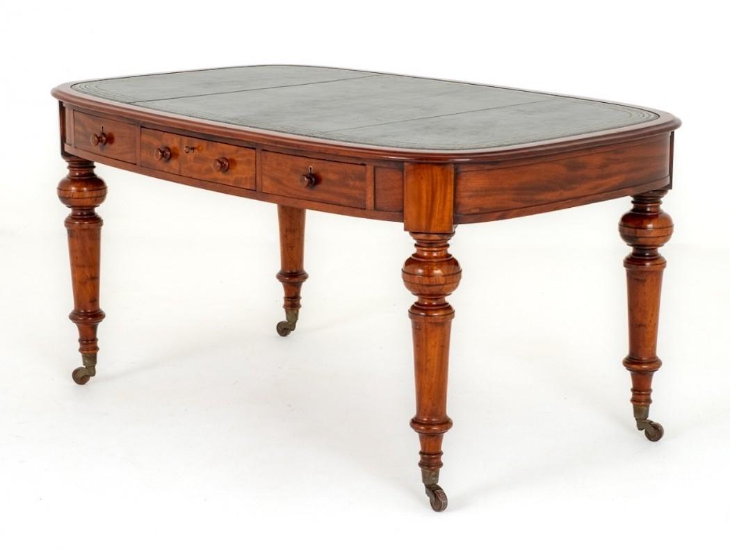 This Victorian Mahogany Writing Table being of an unusual Oval Form.
Circa 1870
Standing upon Ring Turned Legs With Original Brass and Porcelain castors.
The Table Features 6 Mahogany Lined Drawers Which Retain the Original Knobs and Locks.
The Top