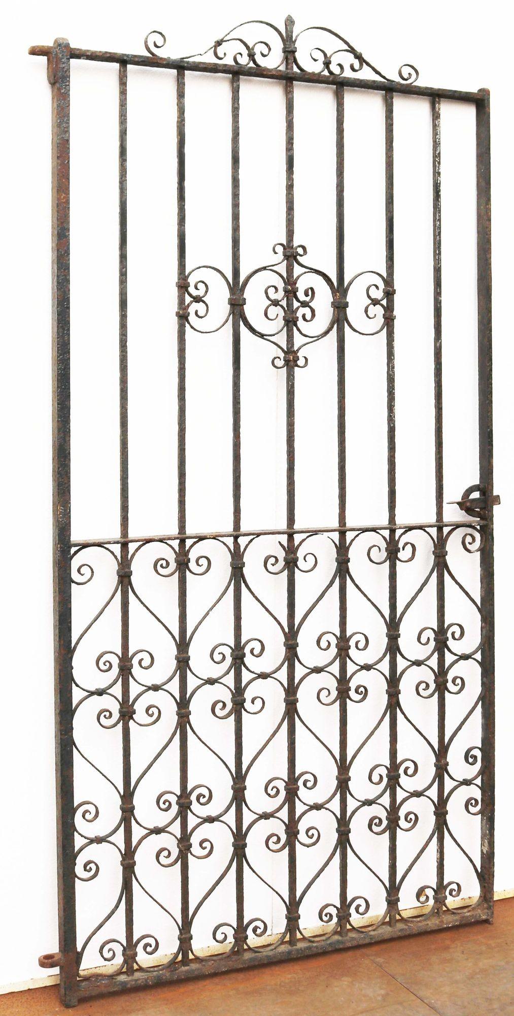 Victorian wrought iron side gate. A beautiful 19th century side gate with decorative scrollwork in an elegant design.