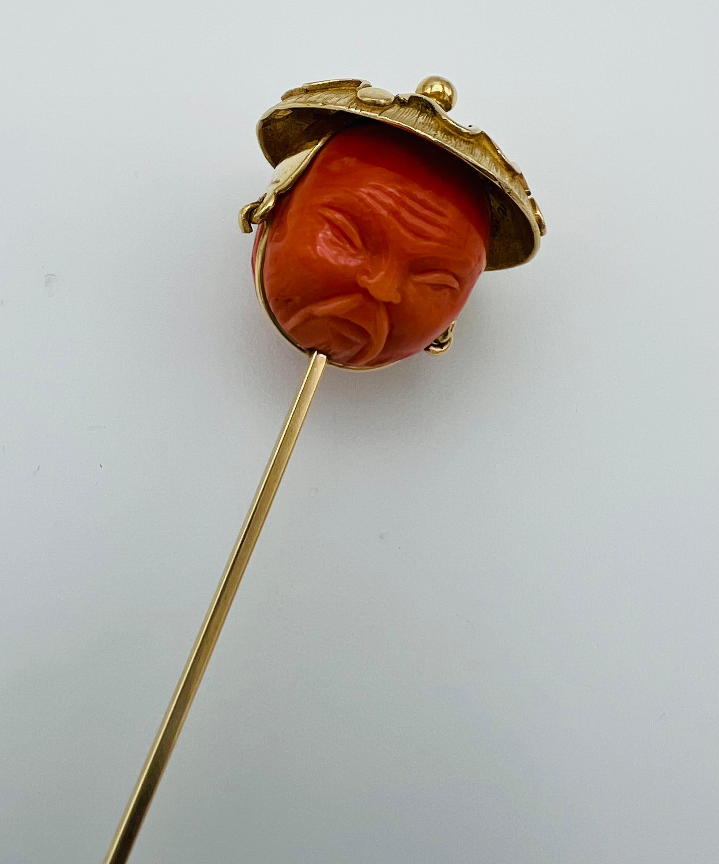 Product details:

The pin is made out of yellow gold and carved coral. It features Asian motif.
