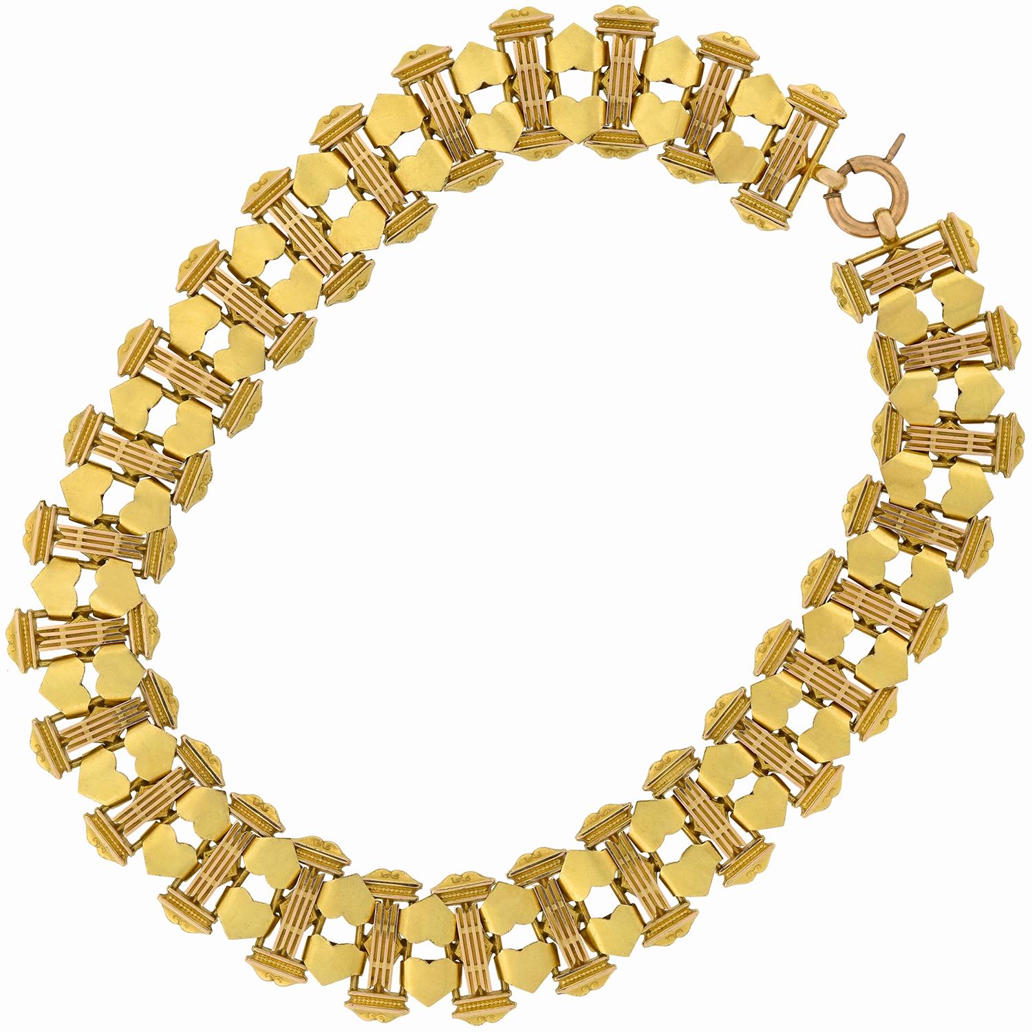 A fabulous gold book chain from the Victorian (ca1880) era! This amazing handmade piece is crafted in rich 15kt yellow gold and comprised of alternating Roman column and heart shaped links which carry around the entire length. The rectangular column
