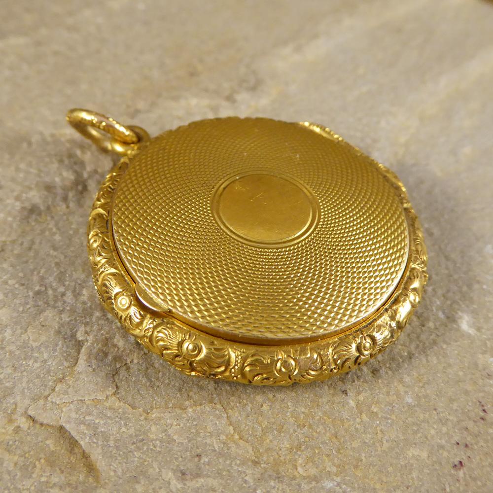 This lovely locket has an extra special feature of being able to be opened from both sides with one side having a thin frames for a picture to be placed behind. created fully from 15ct Yellow Gold with exquisite detailing around the sides and on the