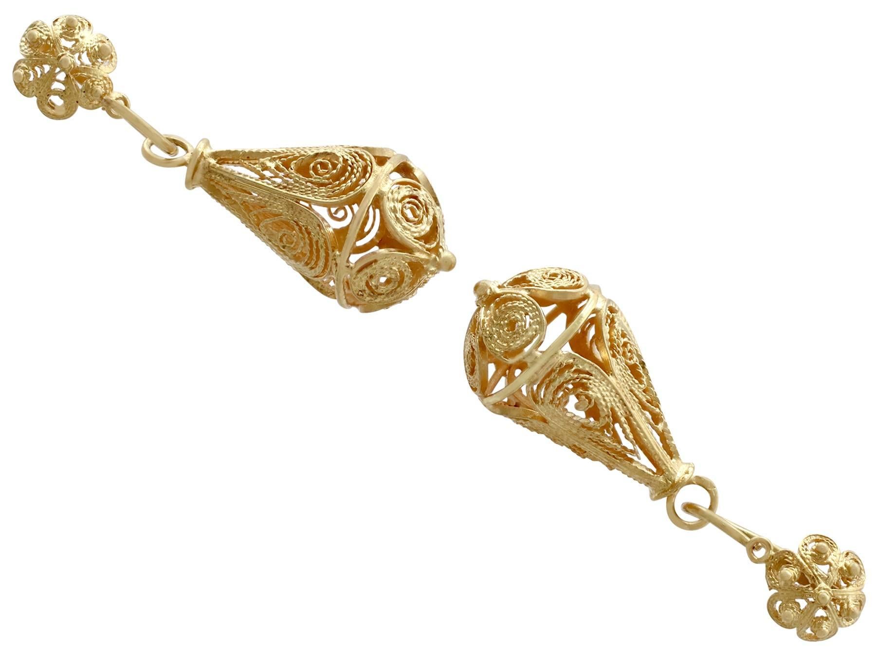 An impressive pair of antique Victorian 21 carat yellow gold drop earrings; part of our diverse antique jewellery and estate jewelry collections.

These fine and impressive Victorian gold drop earrings have been crafted in 21ct yellow gold.

Each