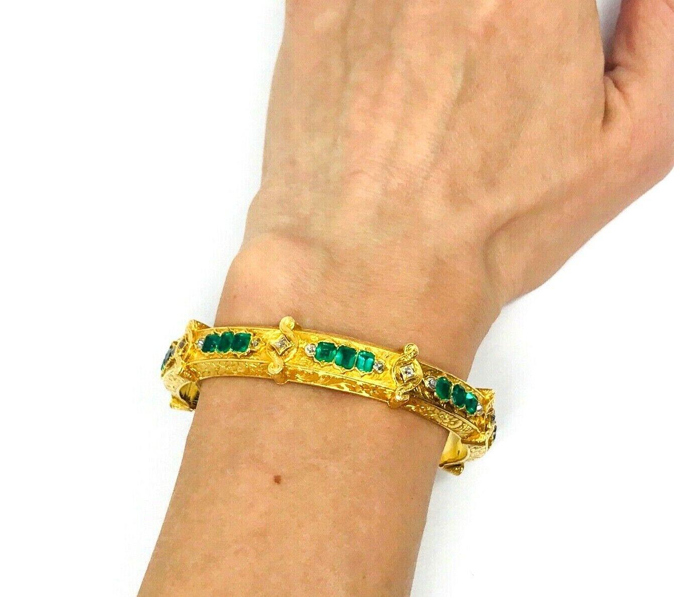 Beautiful Victorian 18k (tested) yellow gold bangle bracelet features emerald and diamond. The bangle has fine floral engraving goes throughout the surface. Diamonds are set in the swirled gold elements. 
Measurements: inner circumference is 7