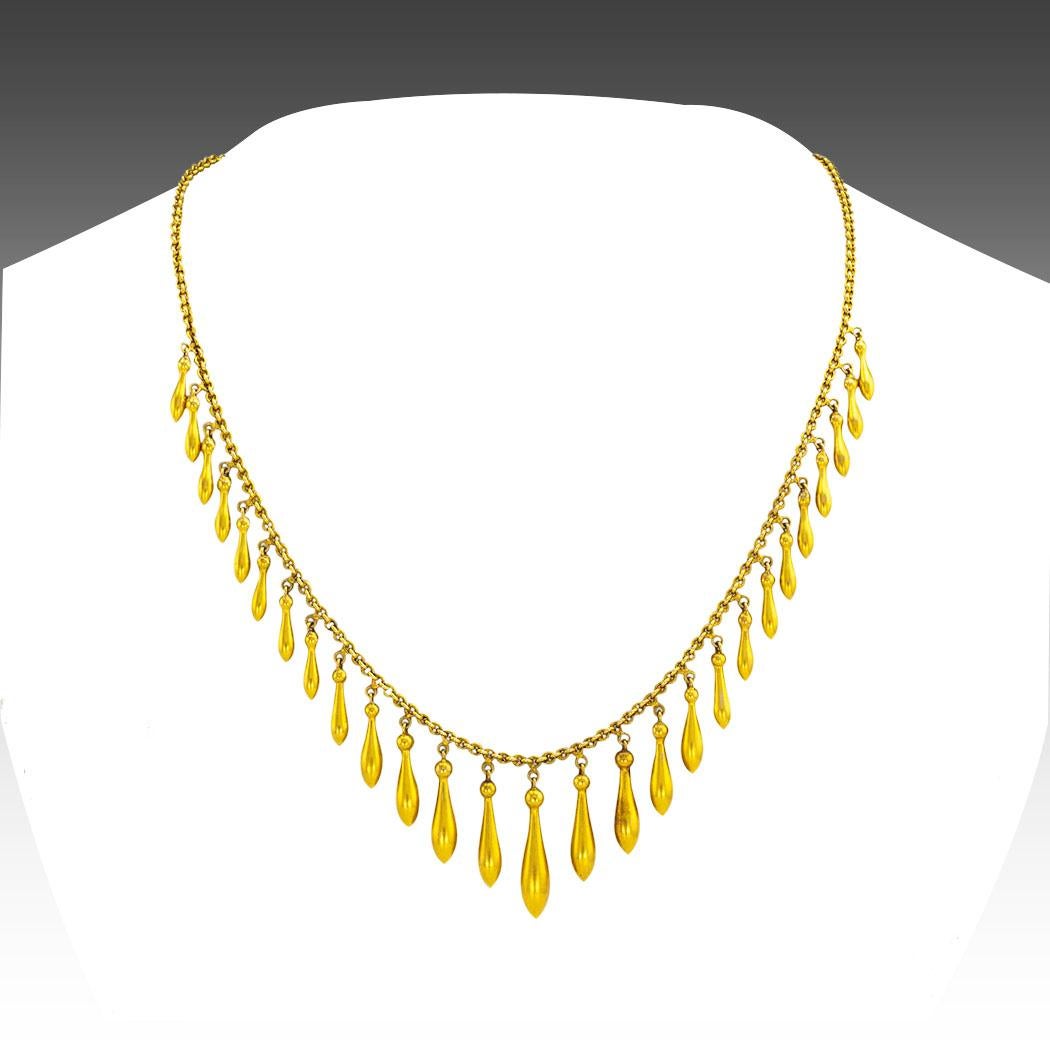 Victorian graduated gold fringe necklace circa 1880. *

ABOUT THIS ITEM:  #N-DJ78B. Scroll down for specifications.  Delicate, feminine, and very impressive, together they sum up the essence of this beautiful Victorian fringe necklace.  It is all