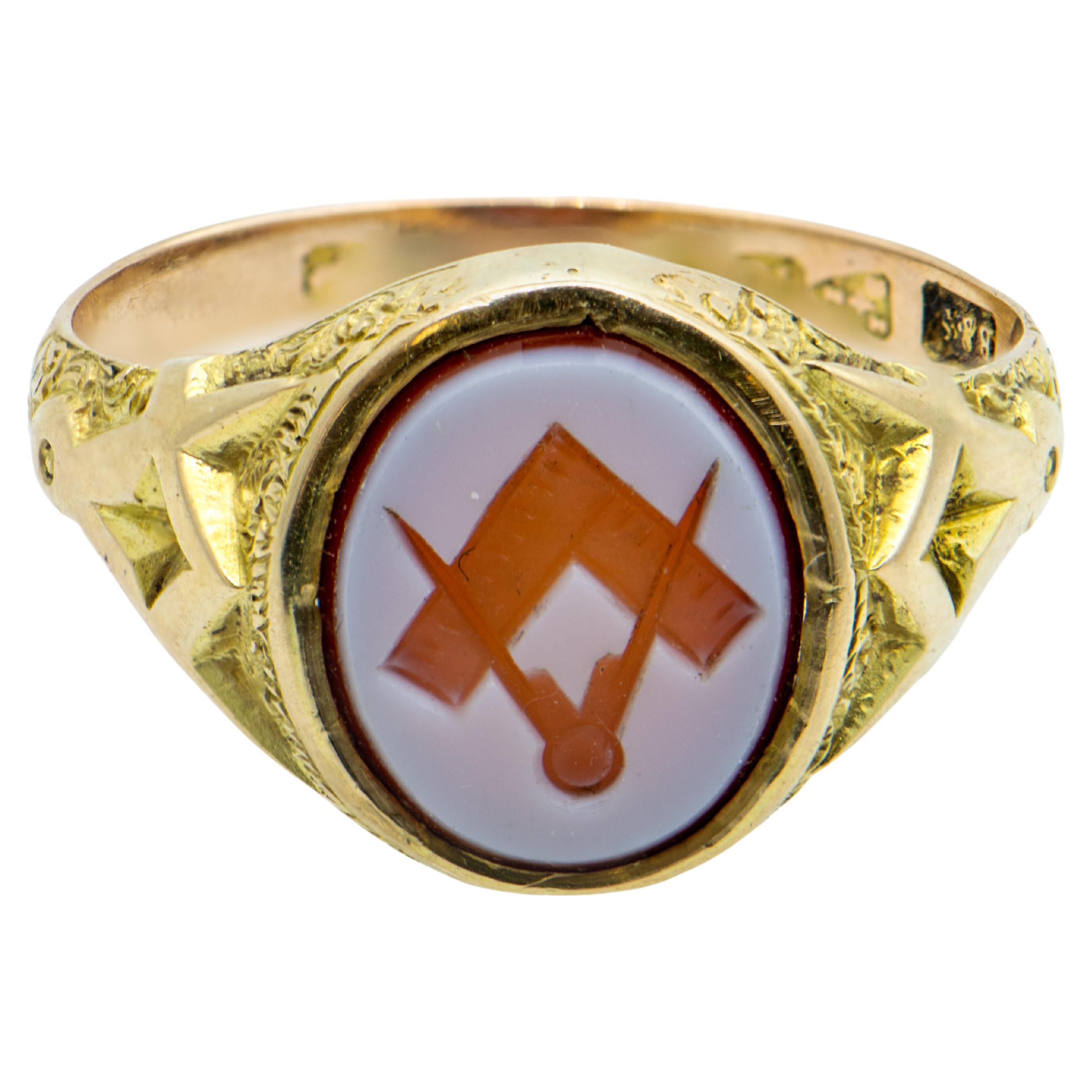 Victorian 15 Carat Yellow Gold Masonic Ring
Square and Compasses carved on Oval Sardonyx and
Gold Square and Compasses on the shoulders.
Oval stone dimensions: 11.5mm x 9.6mm .
Ring Size T (US 9 3/4)
Weight of the ring is 5.76 grams
Very Good