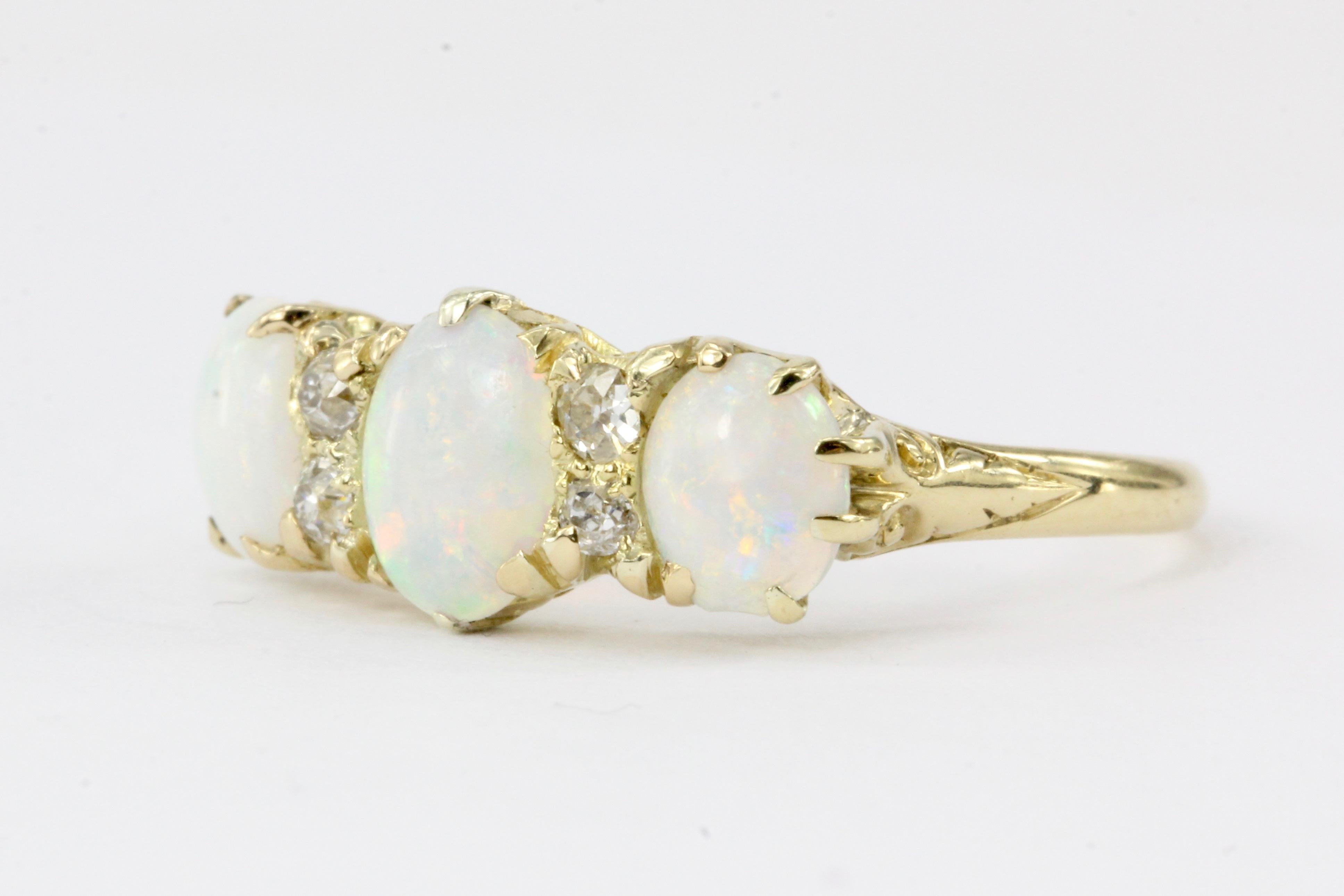 Era: Victorian (late 1800’s)

Hallmarks: 18K

Composition: 18K Yellow Gold

Primary Stone: Opals

Stone Carat: Approximately .75 carats total weight

Shape: oval

Accent Stone: Old Mine Cut Diamonds

Color/Clarity: I/J - VS2/SI1

Total Diamond