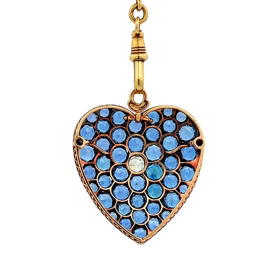 This extraordinary heart-shaped pendant features eighteen carats of rare Montana sapphires from Yogo Gulch with a half carat diamond in the center. 

Era: c. 1900

Sapphires: 18 carats total weight 

Diamond: 0.50 carats

Metal: 14K Yellow Gold and
