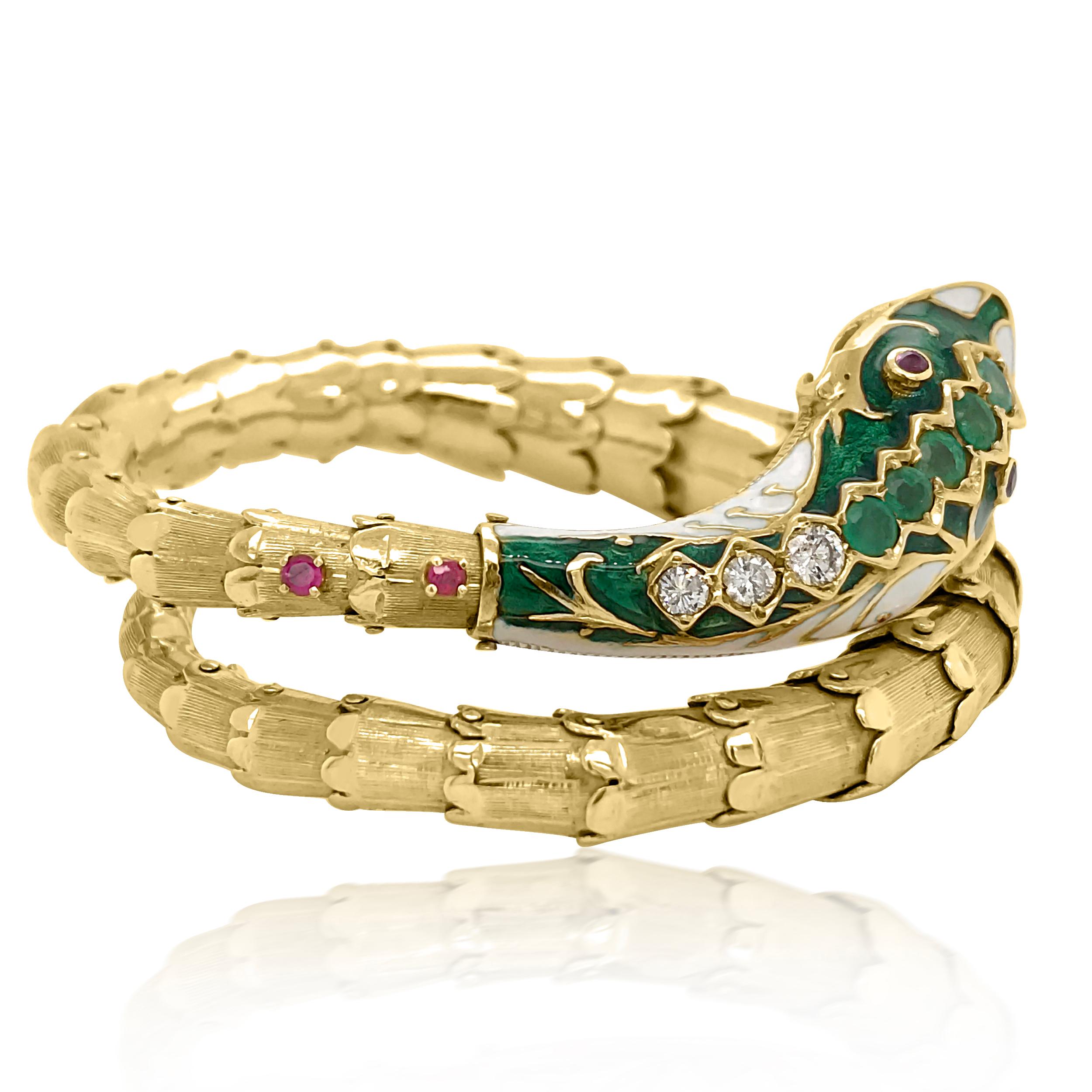 This stylish unique Victorian enamel, diamond, and ruby snake bangle bracelet is crafted in 14-karat gold. Depicting a scaled snake artistically rendered in vibrant green and white enamel. The snakes head is composed of 5 round emerald weighing