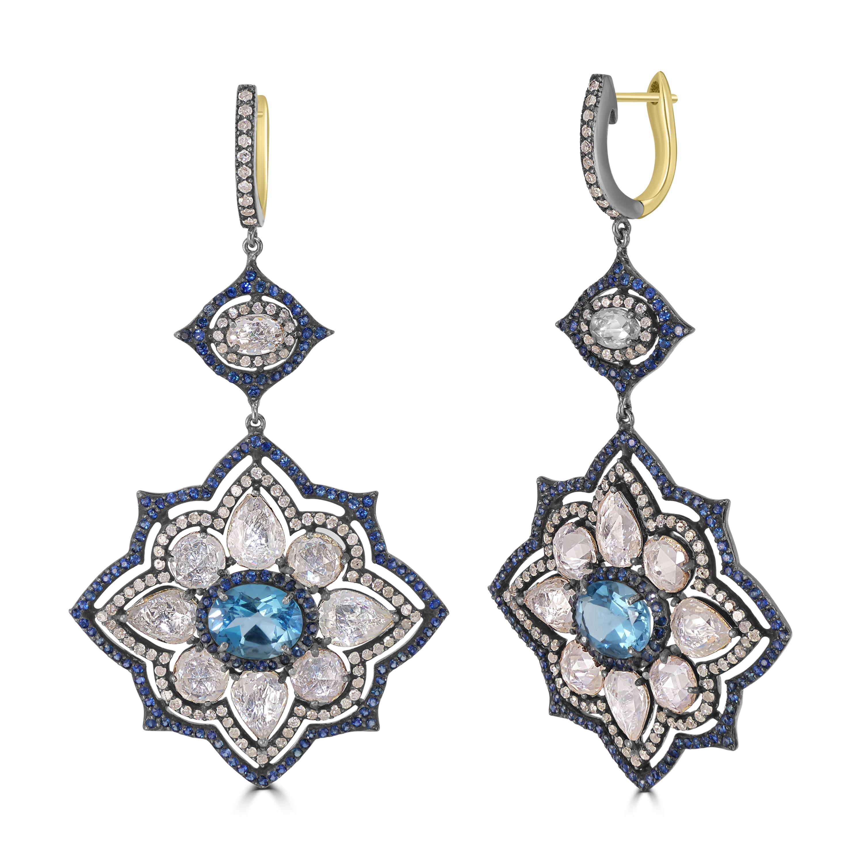 Elevate your elegance with our Victorian 24.87 Cttw. Sapphire, Blue Topaz, and Diamond Floral Dangle Earrings—a masterpiece of timeless beauty and intricate craftsmanship. The drop of these exquisite earrings unveils a captivating floral arrangement