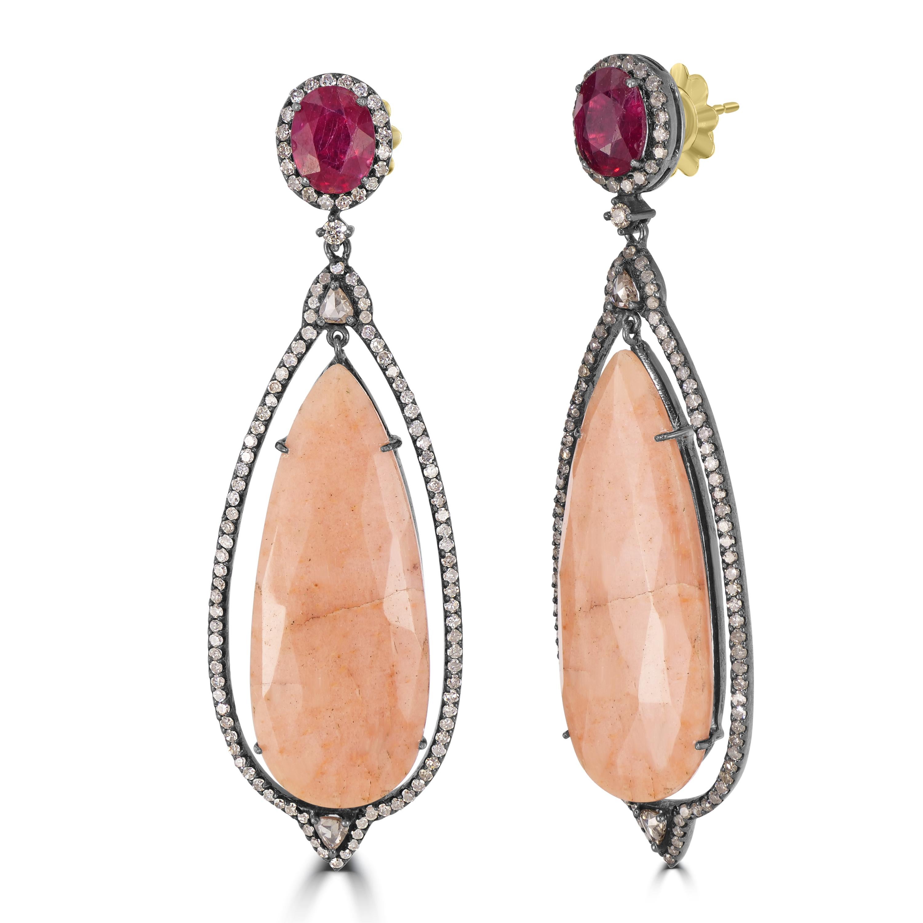 Introducing the Victorian 46.67 Cttw. Agate, Ruby, and Diamond Marquise Drop Dangle Earrings—a breathtaking fusion of sophistication and style that promises to elevate your elegance.

The marquise drop design, a symbol of timeless grace, cradles the