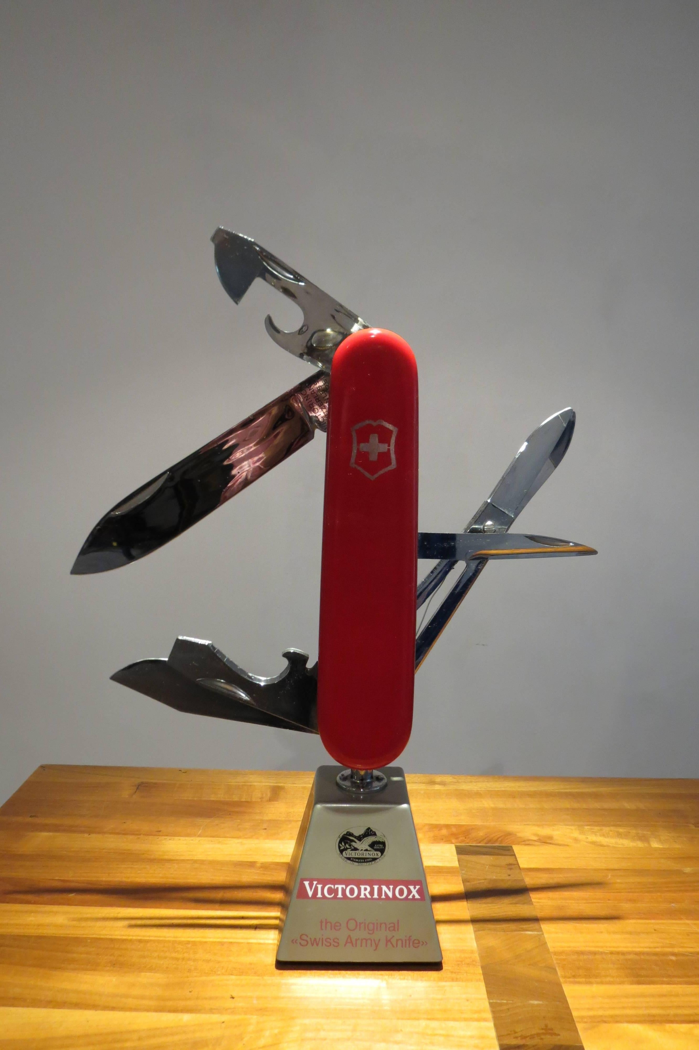 Victorinox Swiss army knife moving display, 1970s
Original 1970s Swiss army knife display. In good working order, a motor runs the knife, opening and closing the scissors and knife blades. Made from plastic.
Stamped Victorinox original Swiss army