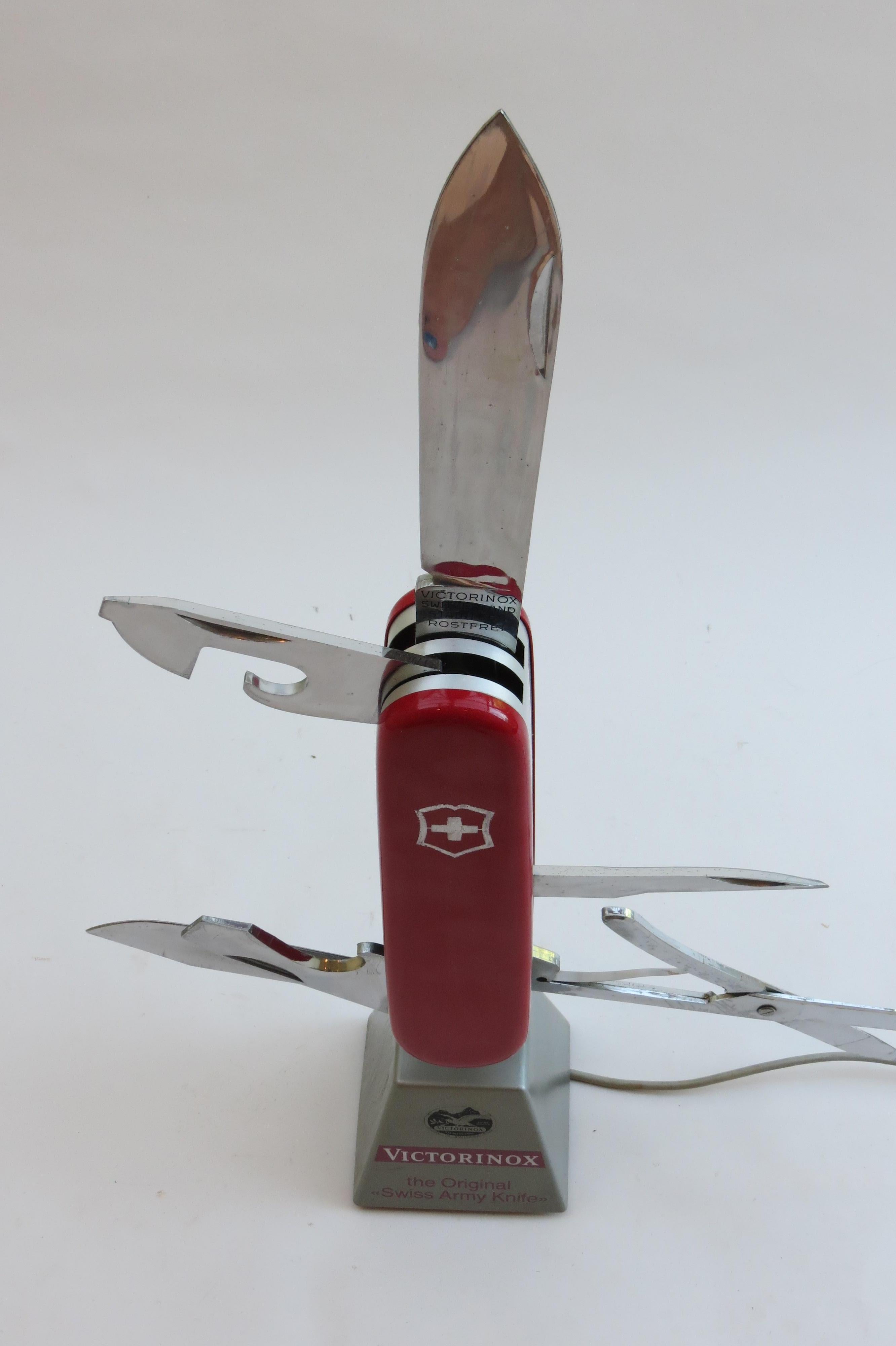 Original 1970s Swiss Army Knife display. In good working order, a motor runs the knife, opening and closing the scissors and knife blades. Made from plastic.
Stamped Victorinox Original Swiss Army Knife, Made in Switzerland Rostfrei.
Case in good