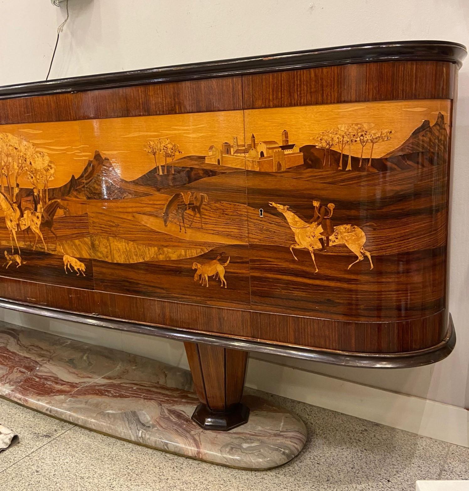 One of a kind enfilade or large sideboard with a horizontal structure made of wood, with wonderful inlay work, by the famous Italian designer Vittorio Dassi during the 1950s. It stands out for the use of different precious woods that give the piece