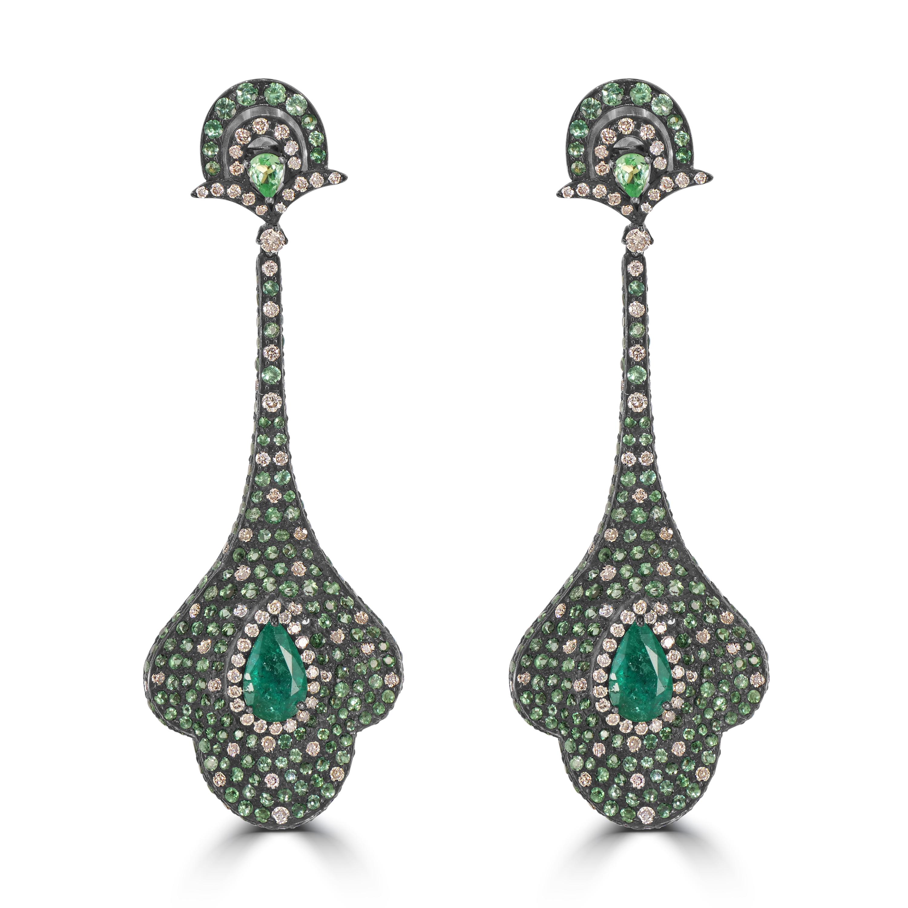 Introducing the Victorian 8.7 Cttw. Emerald, Tsavorite, and Diamond Dangle Earrings—a masterpiece that seamlessly blends opulence, nature-inspired design, and exquisite craftsmanship.

The focal point of these earrings is the goglet drop, a unique