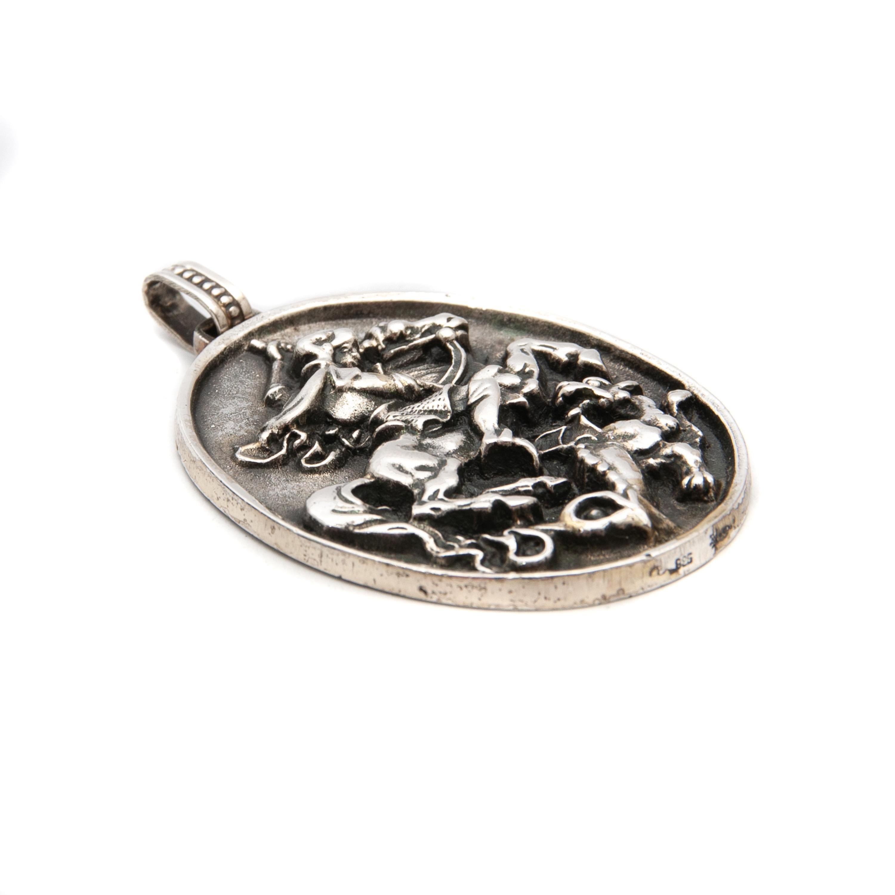 Detailed and heavy silver high relief pendant with a representation of warrior St. George and the Dragon. The large pendant of the victorious dragon slayer was made by Franz Eligius Blachian from first grade silver 925 in Traunstein around 1930. The