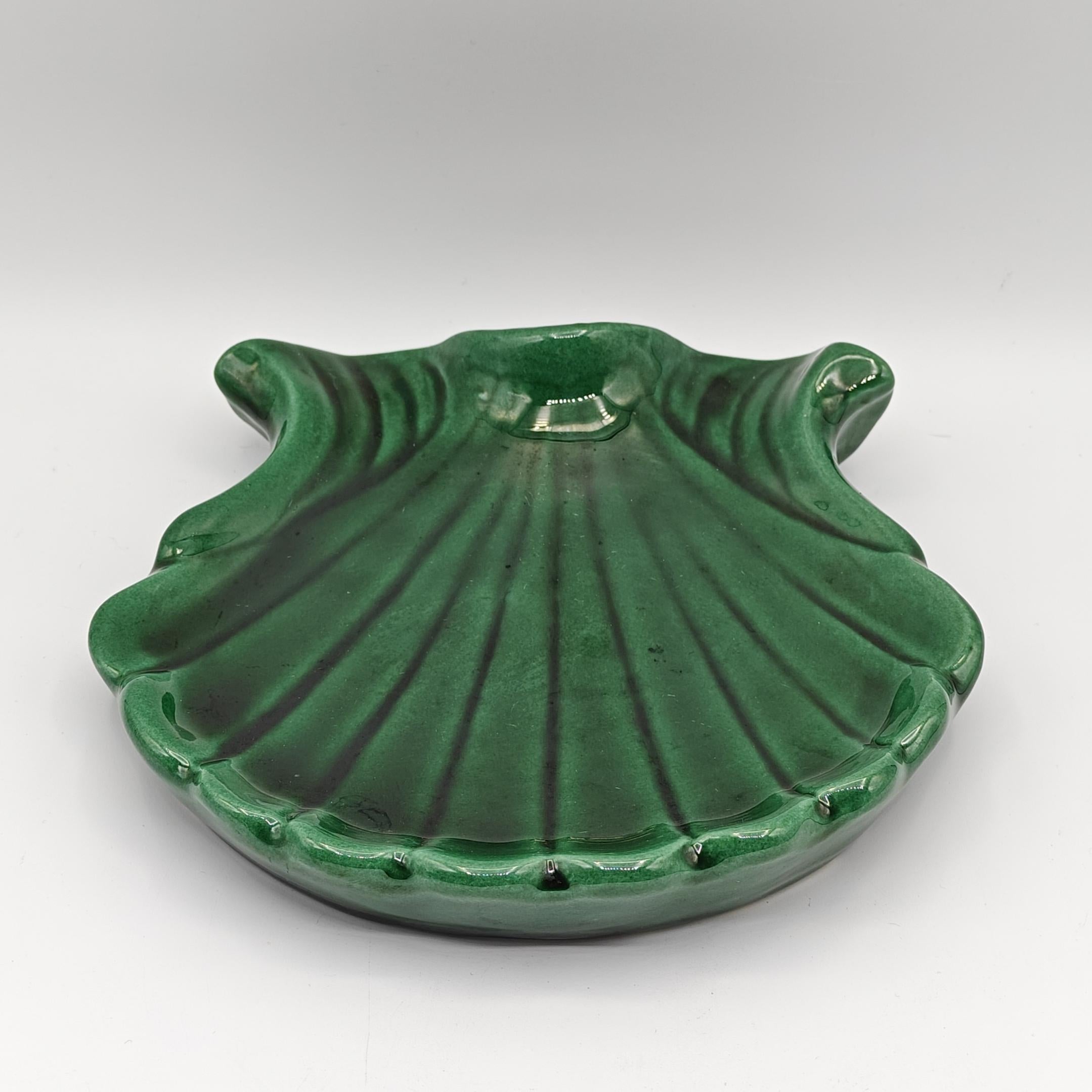 Beautiful glazed ceramic catch-all tray from the renowned Vallauris ceramist, Philippe Giuge, father of Marius Giuge (who was also a ceramist in Vallauris). This catch-all tray depicts a seashell, possibly a scallop shell, and is enamelled in a