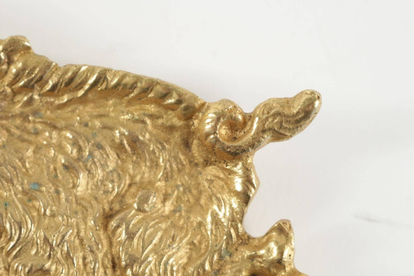 A vide poche in gold gilt representing a wild boar.
 