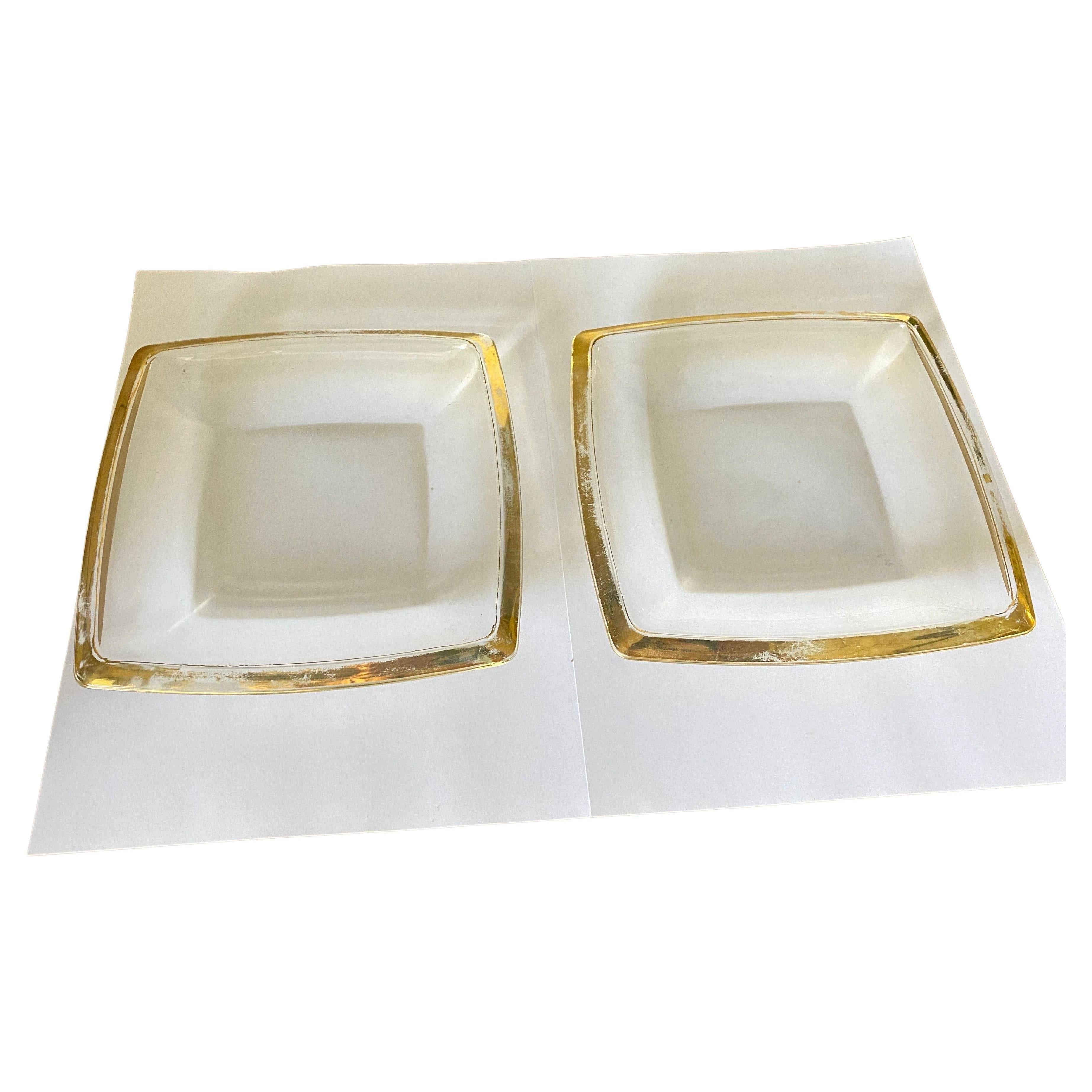 These vide poche or ashtraye in in Glass. It has been done circa 1970, in France.
They are squre shaped  with Golden Borders.
Transparent yellow  and Green Color.