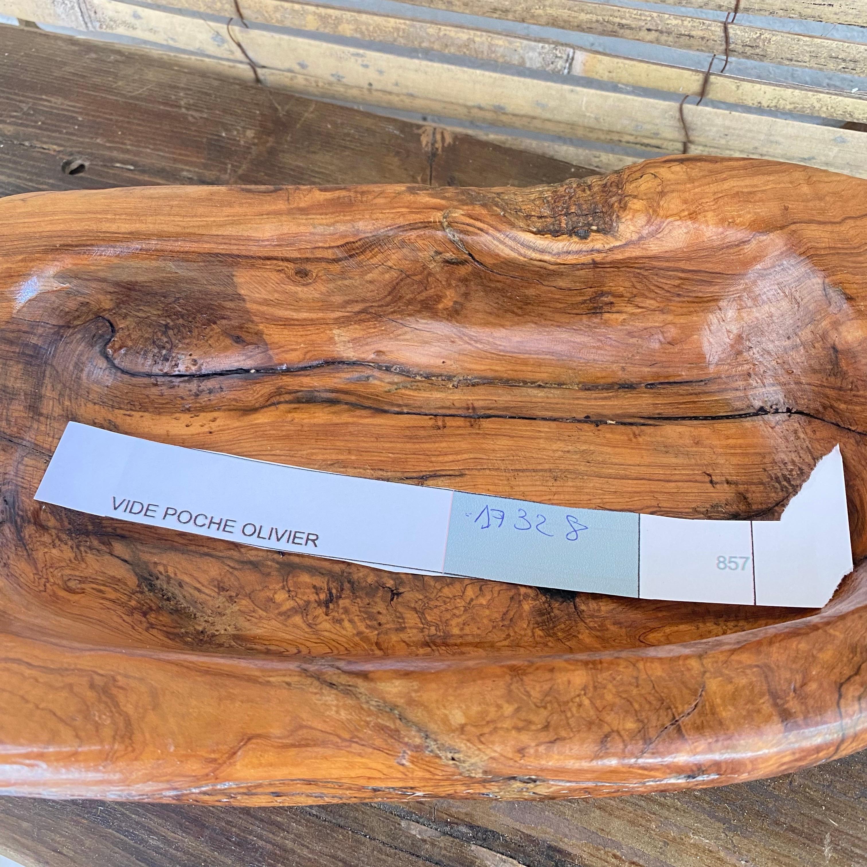 This item is in Olive wood. It has been made in France circa 19510. It can be used as a vide poche or a decorative bowl. It is in the style of Alexandre noll.