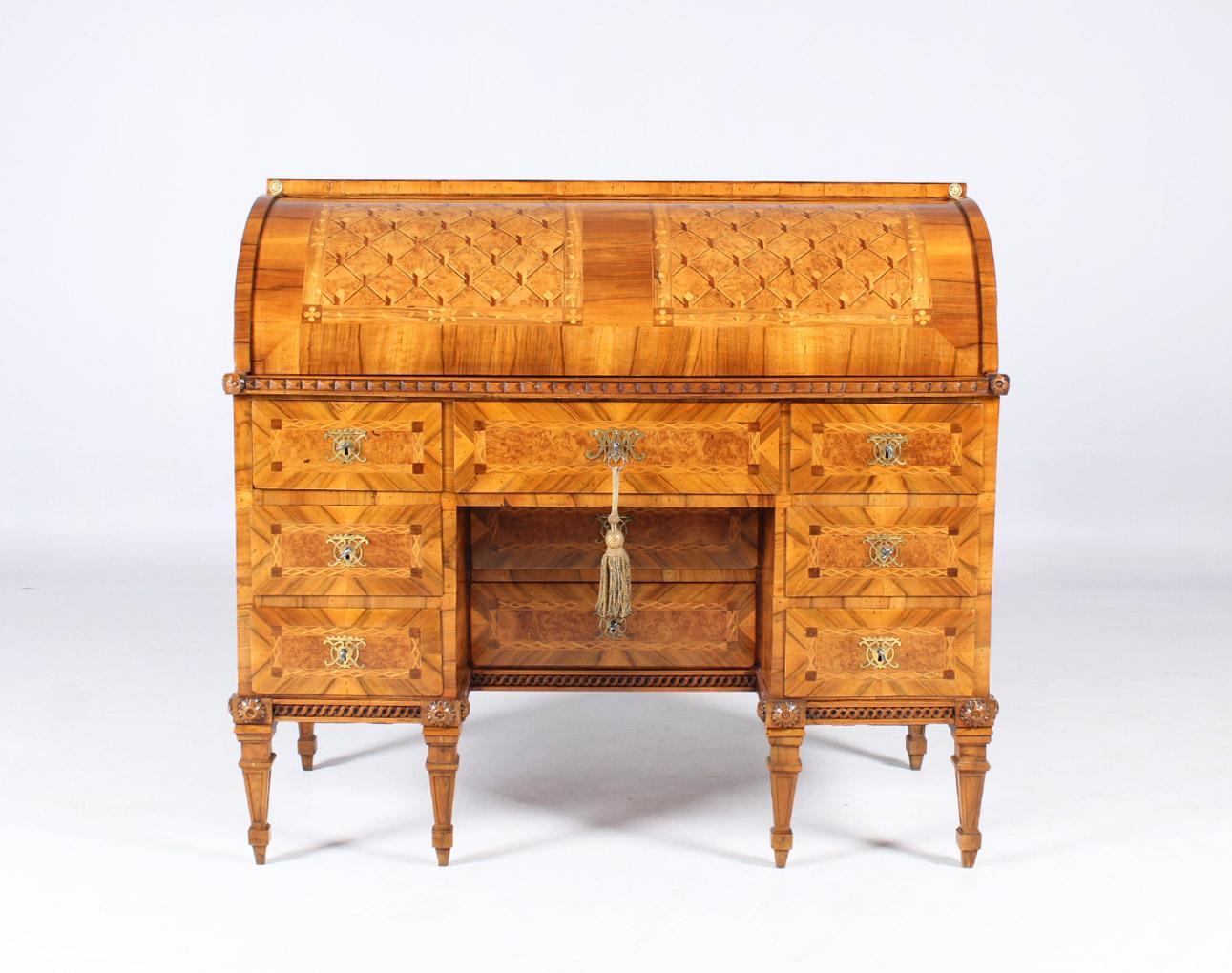 Louis XVI cylinder bureau

South Germany
Walnut etc.
Louis XVI, around 1780

Dimensions: H x W x D: 114 x 125 x 61 cm

Writing furniture standing on typical classicist pointed legs.
Walnut, maple and burl veneered on spruce.

Finely