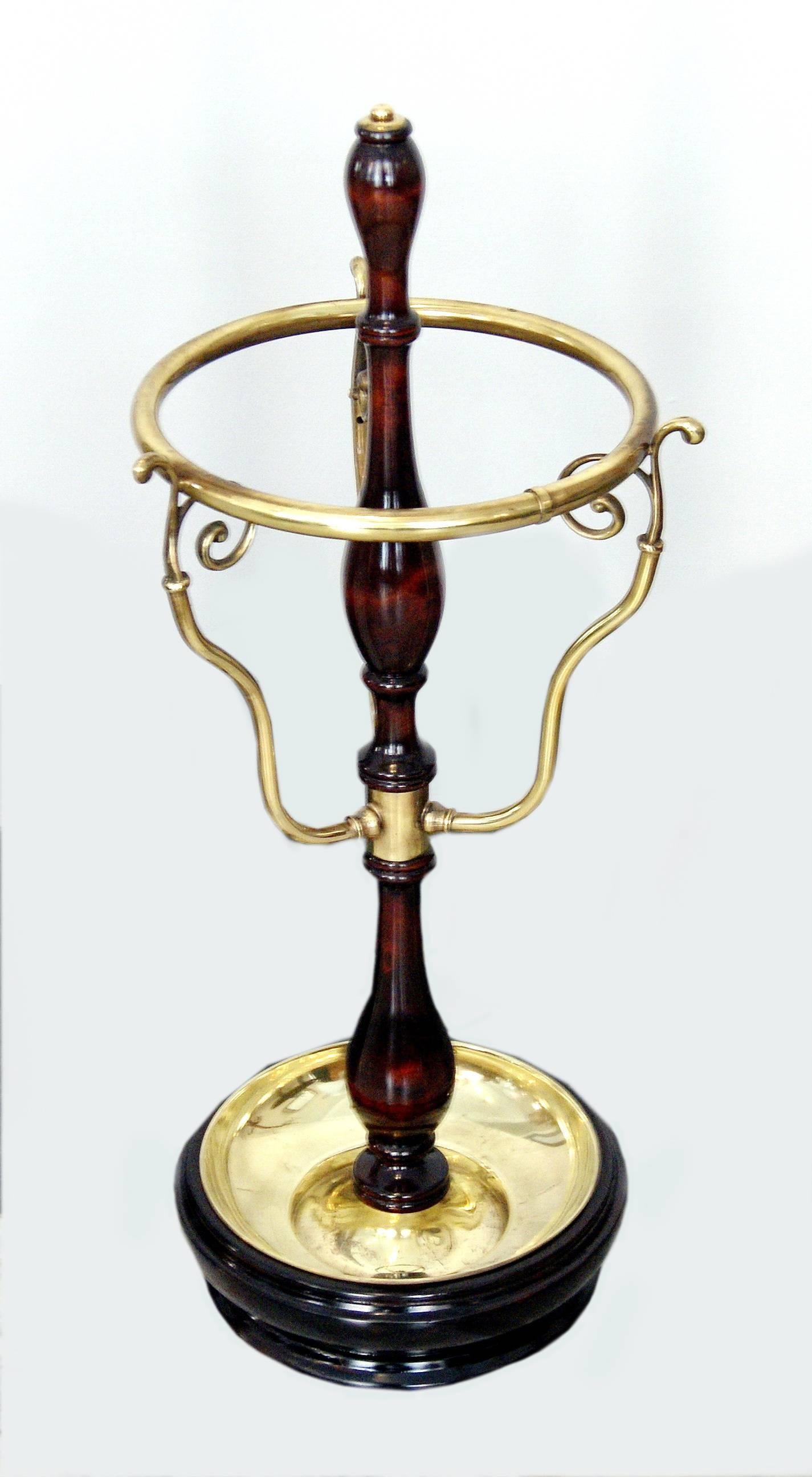 Vienna most elegant Art Nouveau umbrella stand (for holding umbrellas)

This model was certainly created circa 1900. 
The umbrella stand consists of a wooden as well as partially bulged stalk attached to round base which is covered by brass