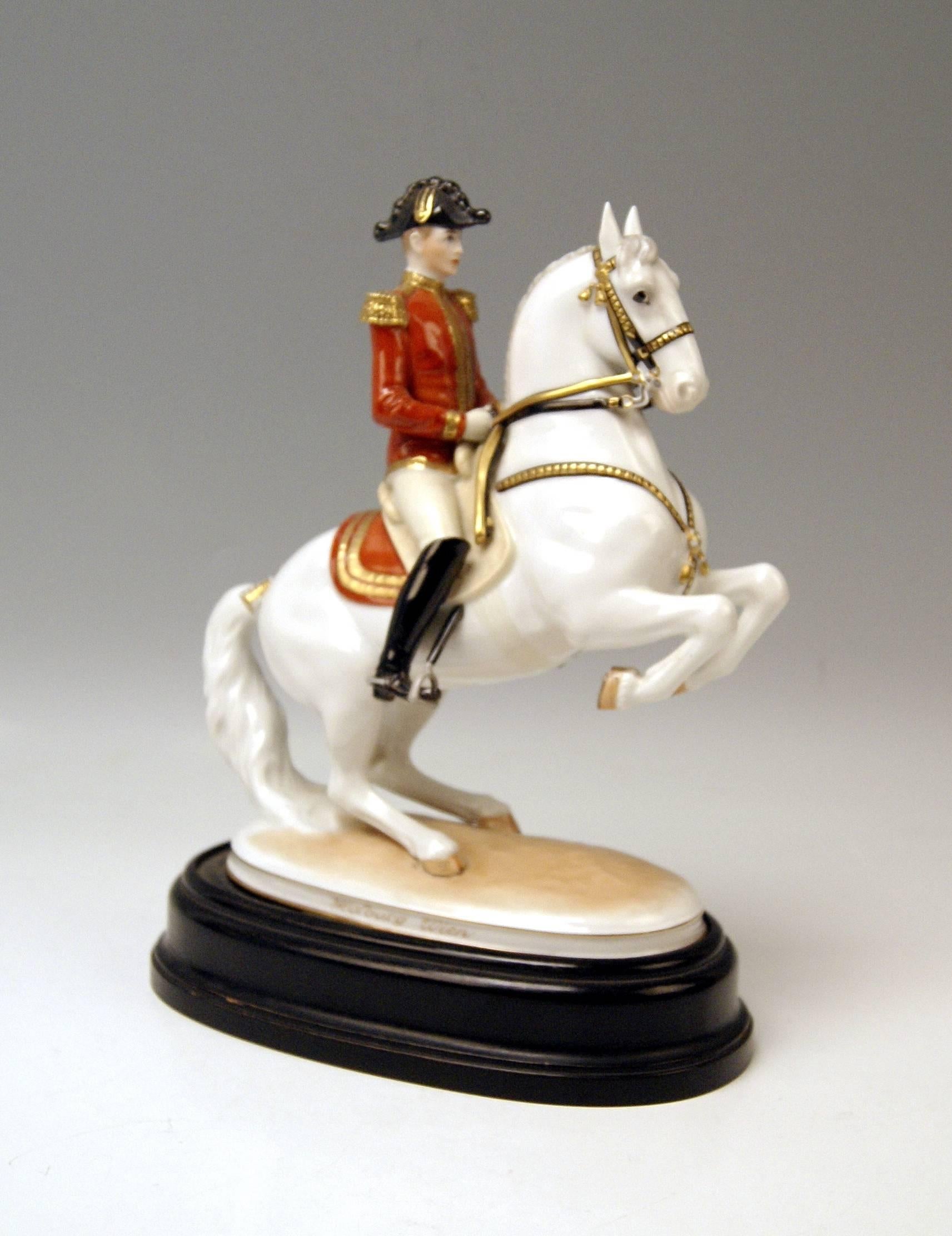 Vienna Augarten Horse Spanish Riding School.
Figurine type: Levade.

The rider conducts the jumping white Lipizzan by the reins. 
The jumping horse depicts a figurine which is called 