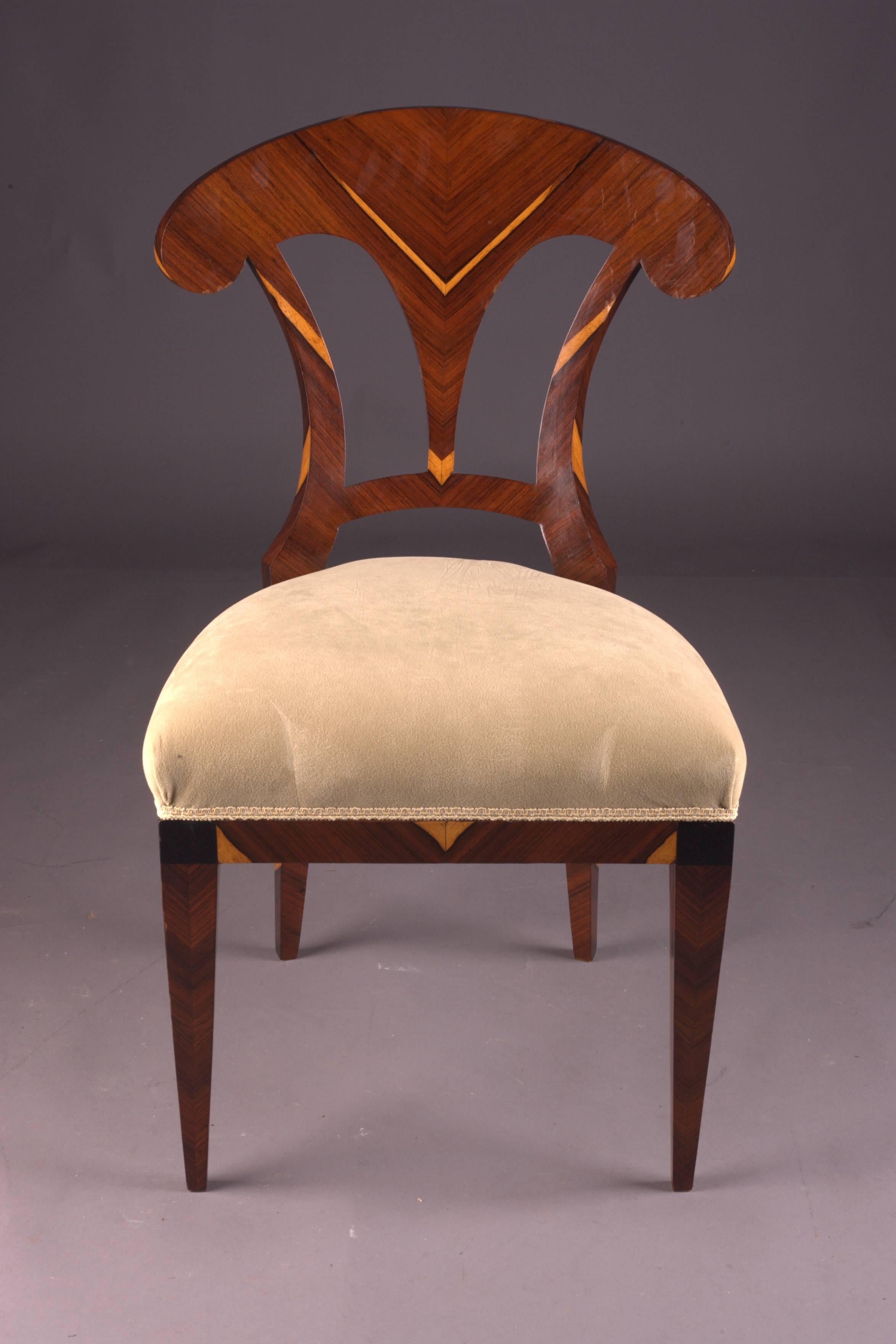 Solid beechwood with Palisander veneer. 
Seat classical upholstered.