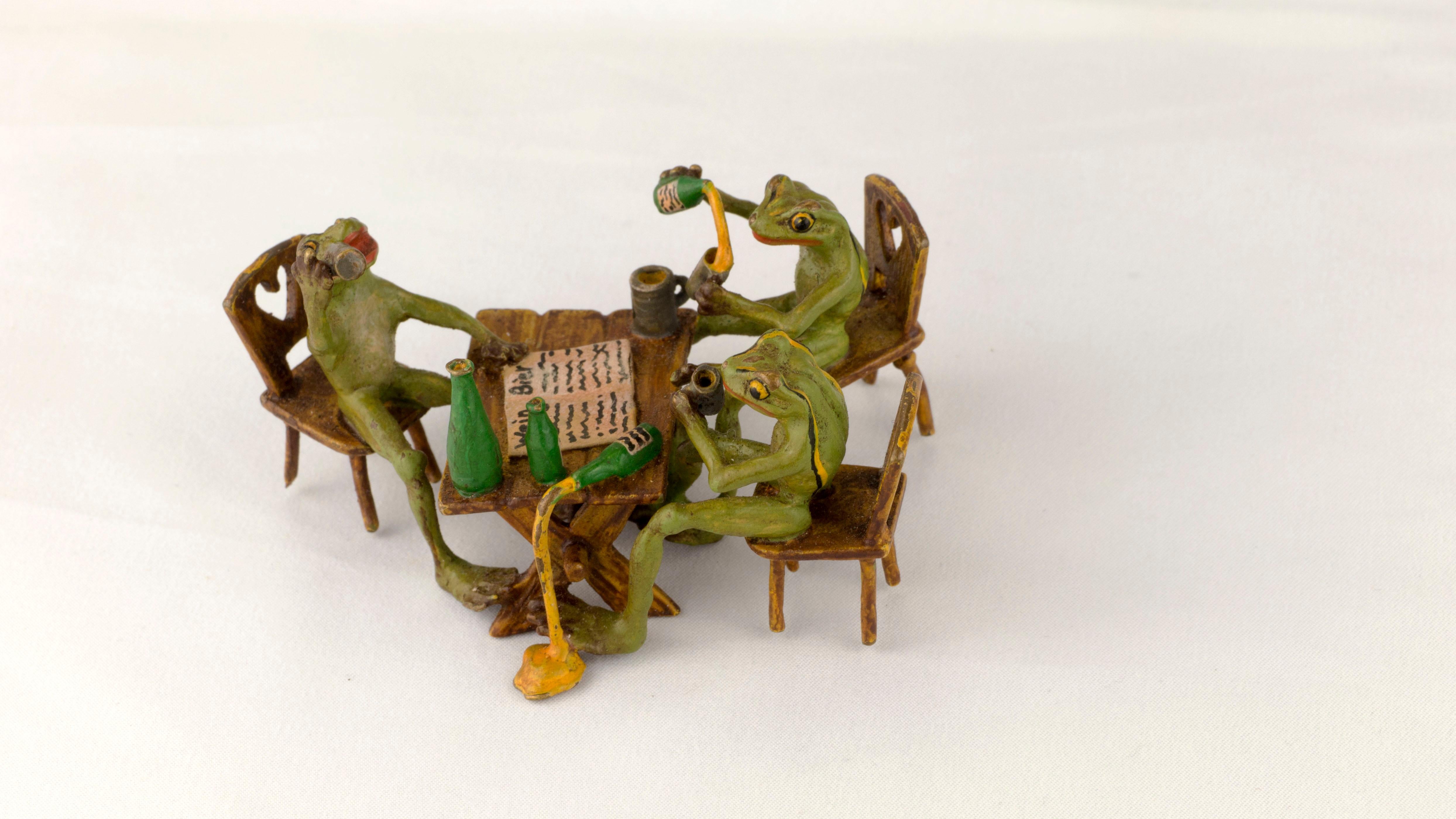 Introducing a charming antique piece, the Gorgeous Vienna Bronze Figurine Group, crafted by the renowned Bergman(n) manufactory during the late 19th century, circa 1890-1900.

The figurine group depicts three playful frogs gathered around a square