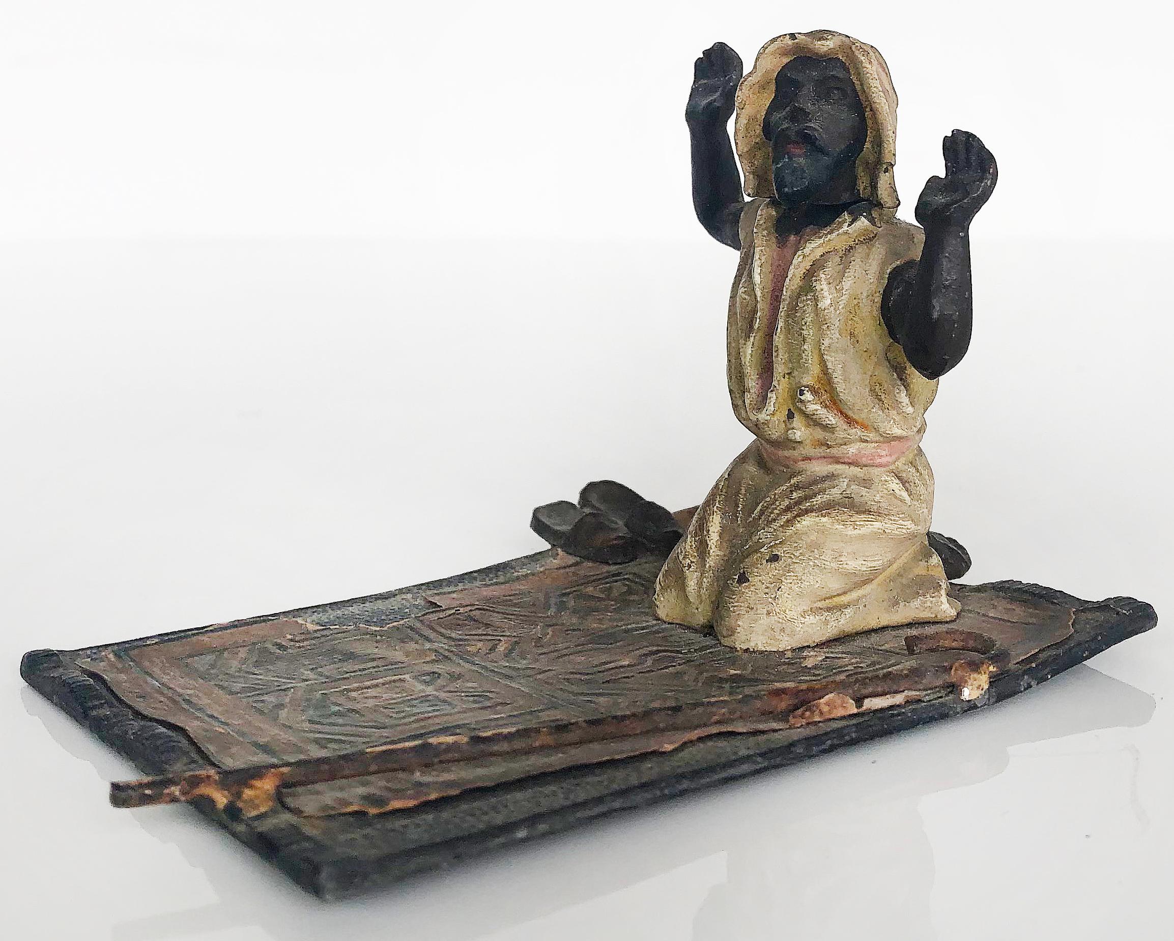 Vienna bronze cold-painted of orientalist man on prayer rug w/bobbing head

Offered is a Vienna cold-painted bronze of an Orientalist man with a bobbing head on a prayer rug.