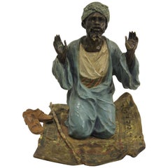 Vienna Bronze of Man Praying on Carpet