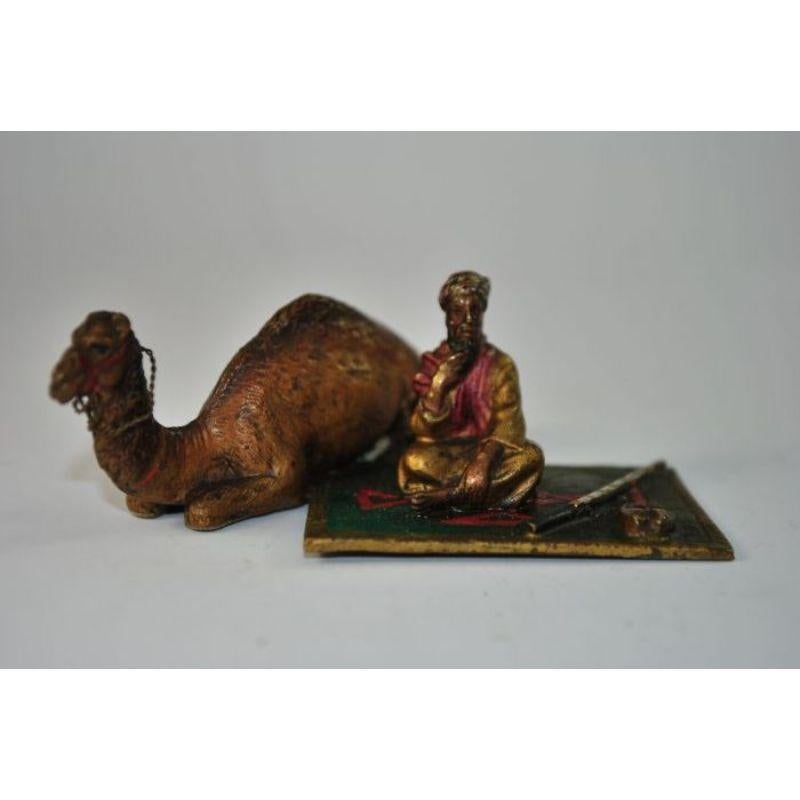 Orientalist Viennese bronze representing a Tuareg on his carpet flanked by his.... Camel because the camel has two humps. Austrian work from the late 19th century. Dimension height 3.5 cm for a length of 7.5 cm.

Additional information:
Material: