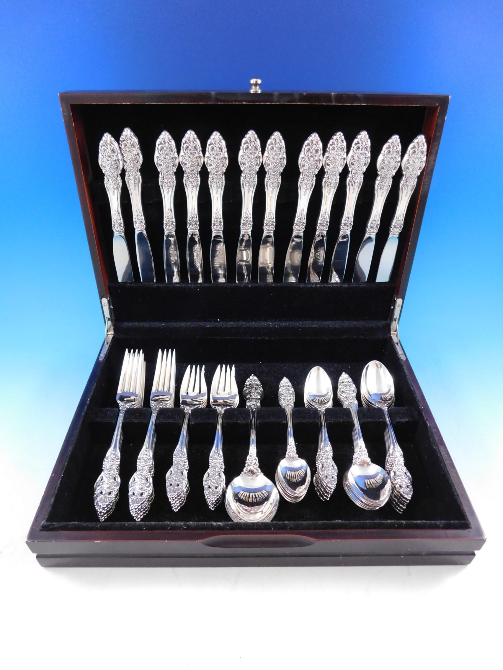 Elegant Vienna by Reed & Barton sterling silver flatware set with ornate floral, pierced handle - 62 pieces. This set includes:

 12 Knives, 9 1/4