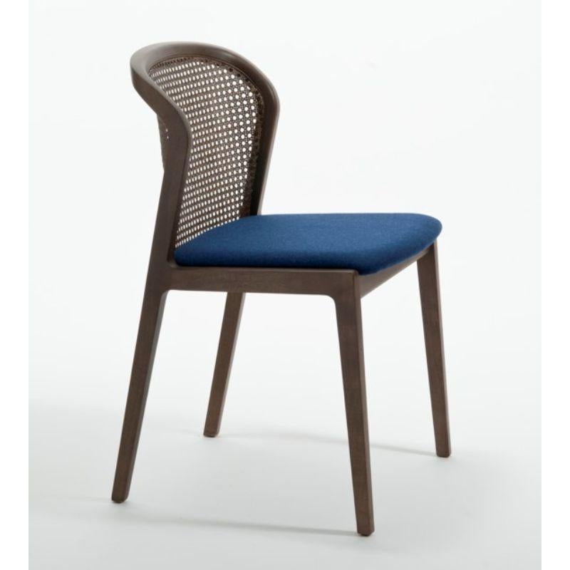 Vienna chair, Canaletto, Nord wool blue by Colé Italiawith Emmanuel Gallina
Dimensions: H 78, W 48, D 50 cm.
Materials: stained beech wood chair with straw back and upholstered seat.
Wood stained finishing: CA Canaletto; WE Wengé; BK