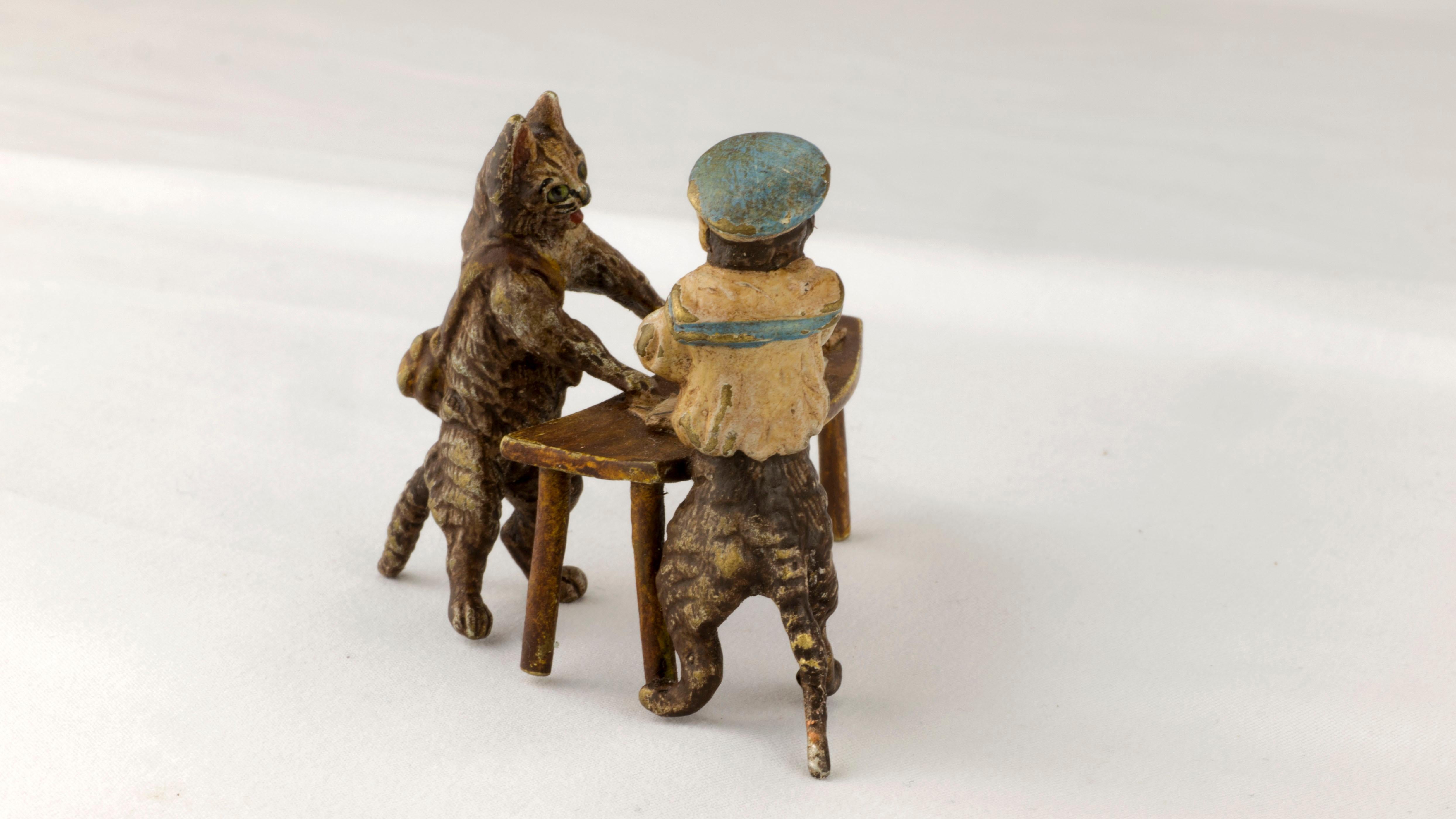 Introducing a delightful antique piece, the Gorgeous Vienna Bronze Figurine Group crafted by the famous Bergman(n) manufactory during the late 19th century, circa 1890-1900.

This charming bronze figurine group depicts Postal Carrier Cat standing
