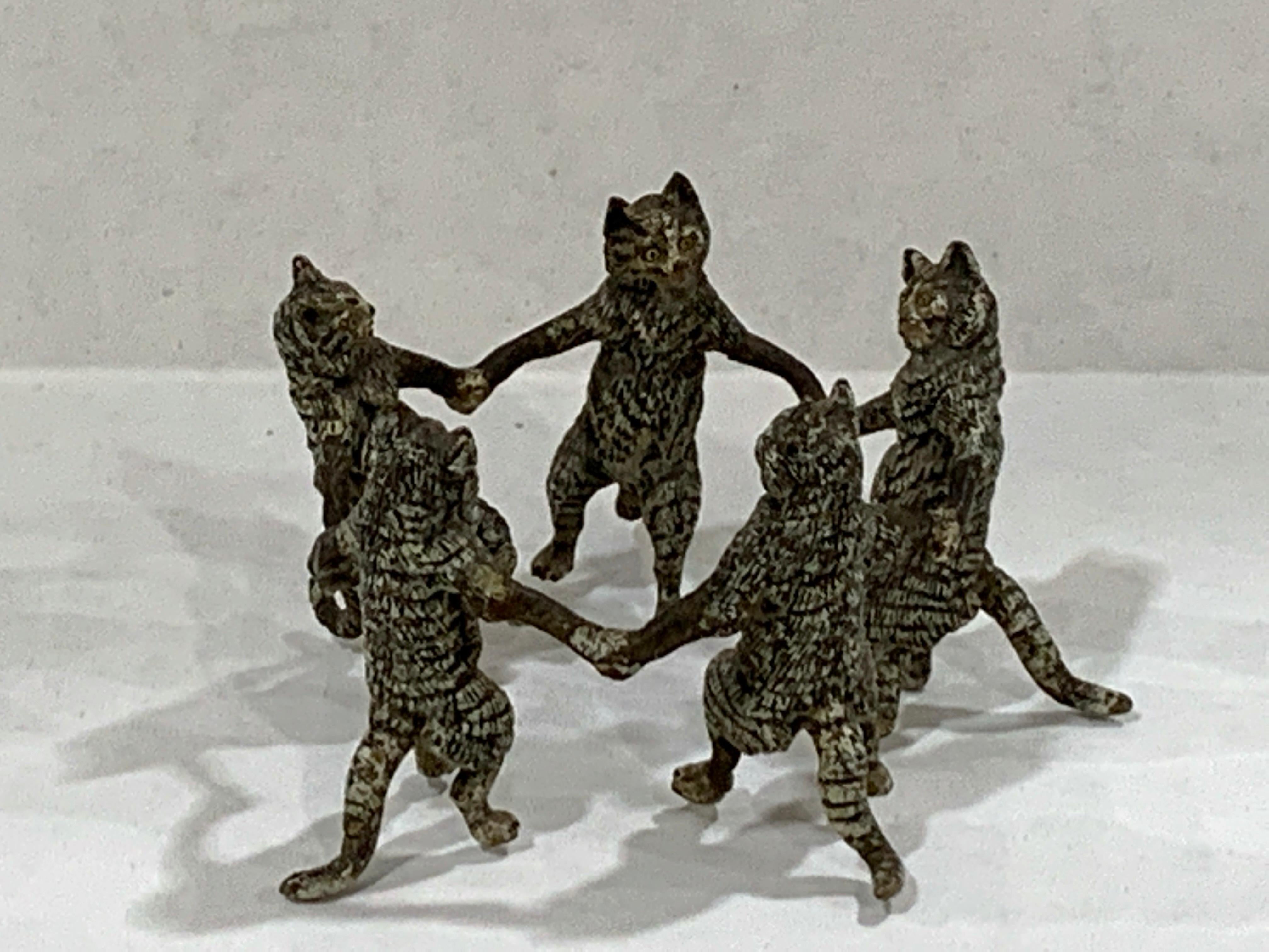 Vienna cold painted bronze dancing cats, attributed to Bergman
Five standing cats realistically modeled and painted holding hands in a circle
Unmarked.