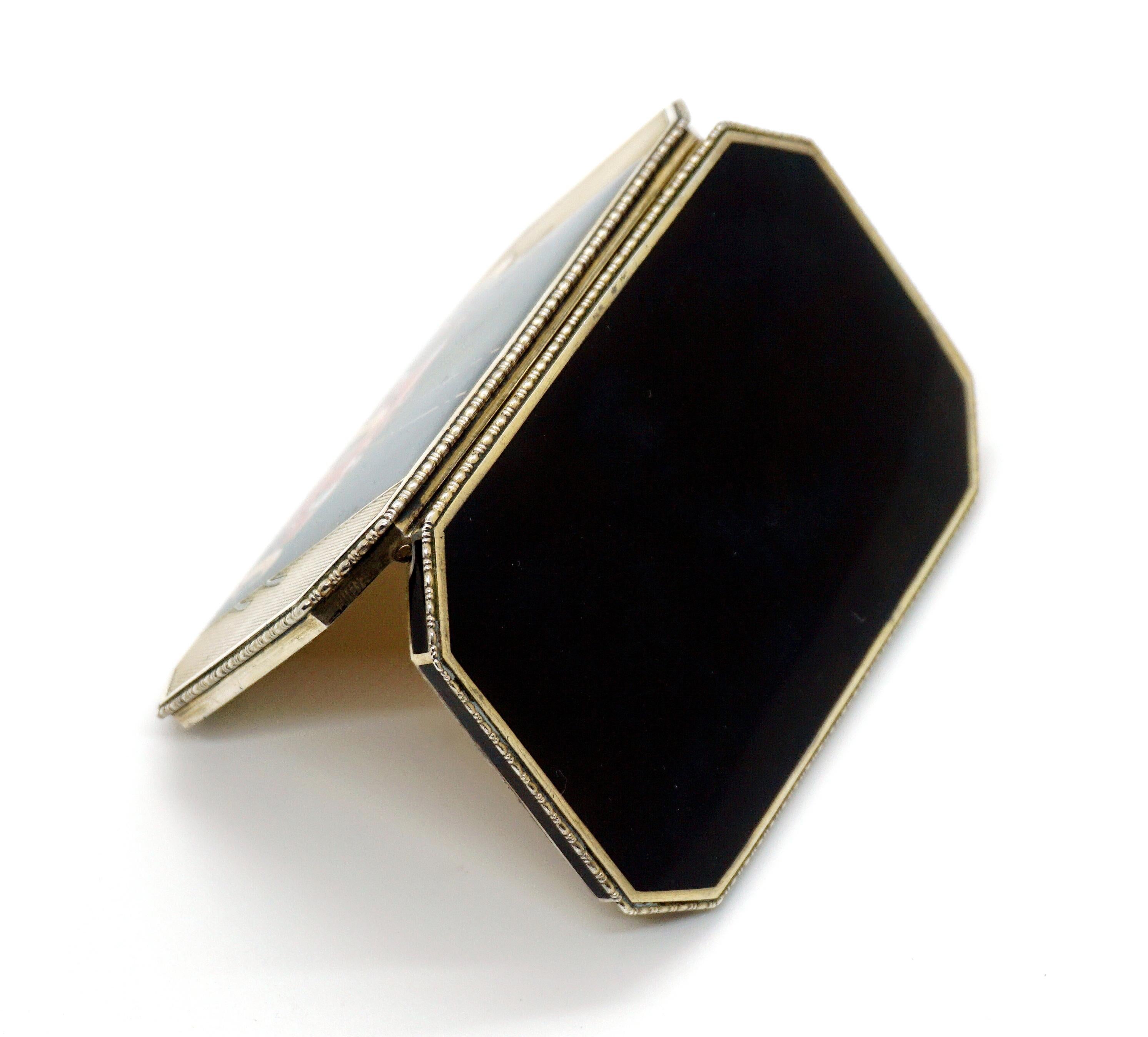 Exquisite Austrian Art Deco enamel box

Octagonal 935 sterling silver cigarette box, partly guilloché, all-round trim, black enamel on top and bottom and on the sides of the lower half of the box. On the lid connected with a hinge, an Austro